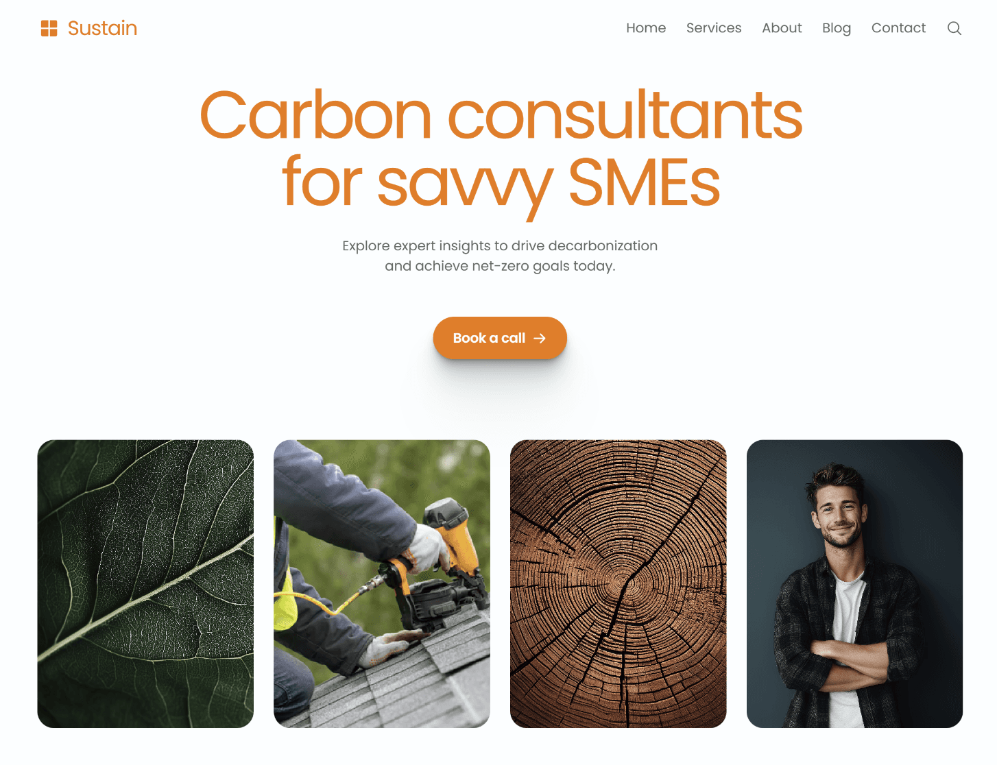 Hand holding a sleek black smartphone or mobile device against a light background