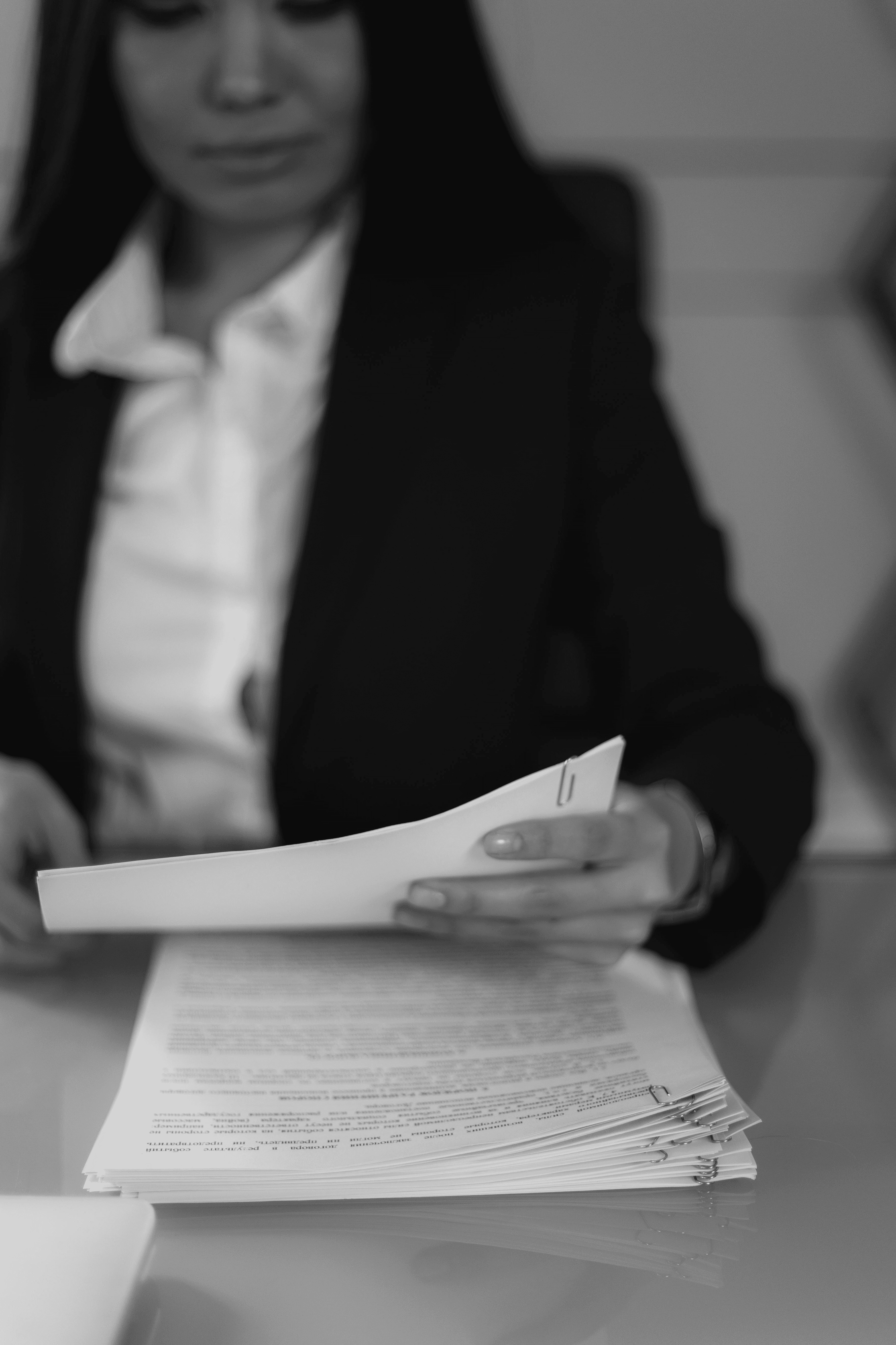 Photo by KATRIN  BOLOVTSOVA: https://www.pexels.com/photo/grayscale-photo-of-a-woman-looking-at-a-document-6077496/