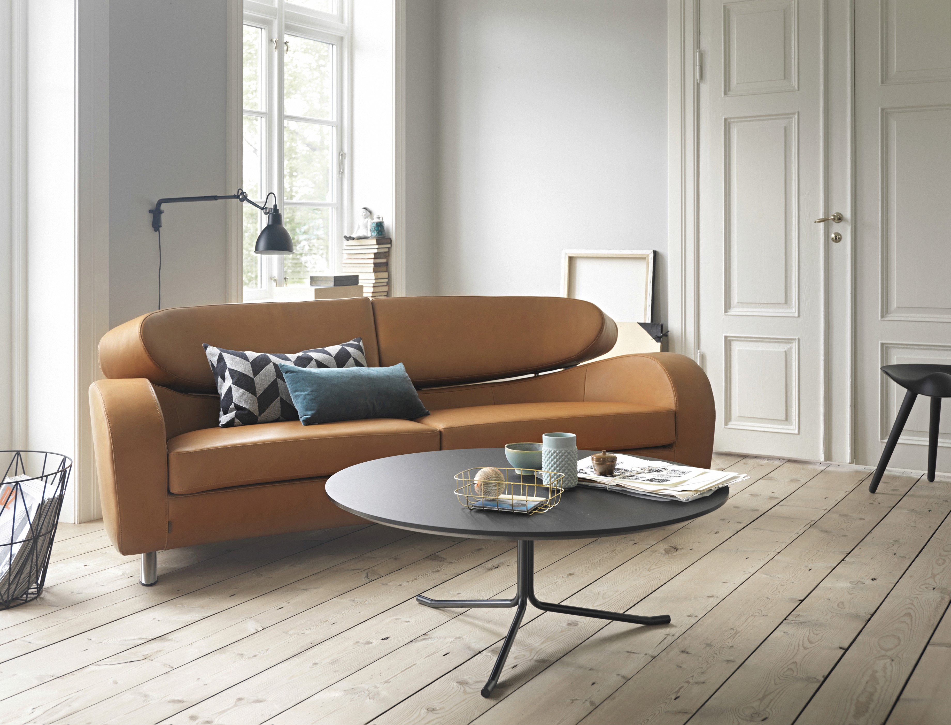 A scene of a wall with glass bottles' shadow casted onto it