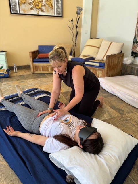 Female yoga instructor teaching a client