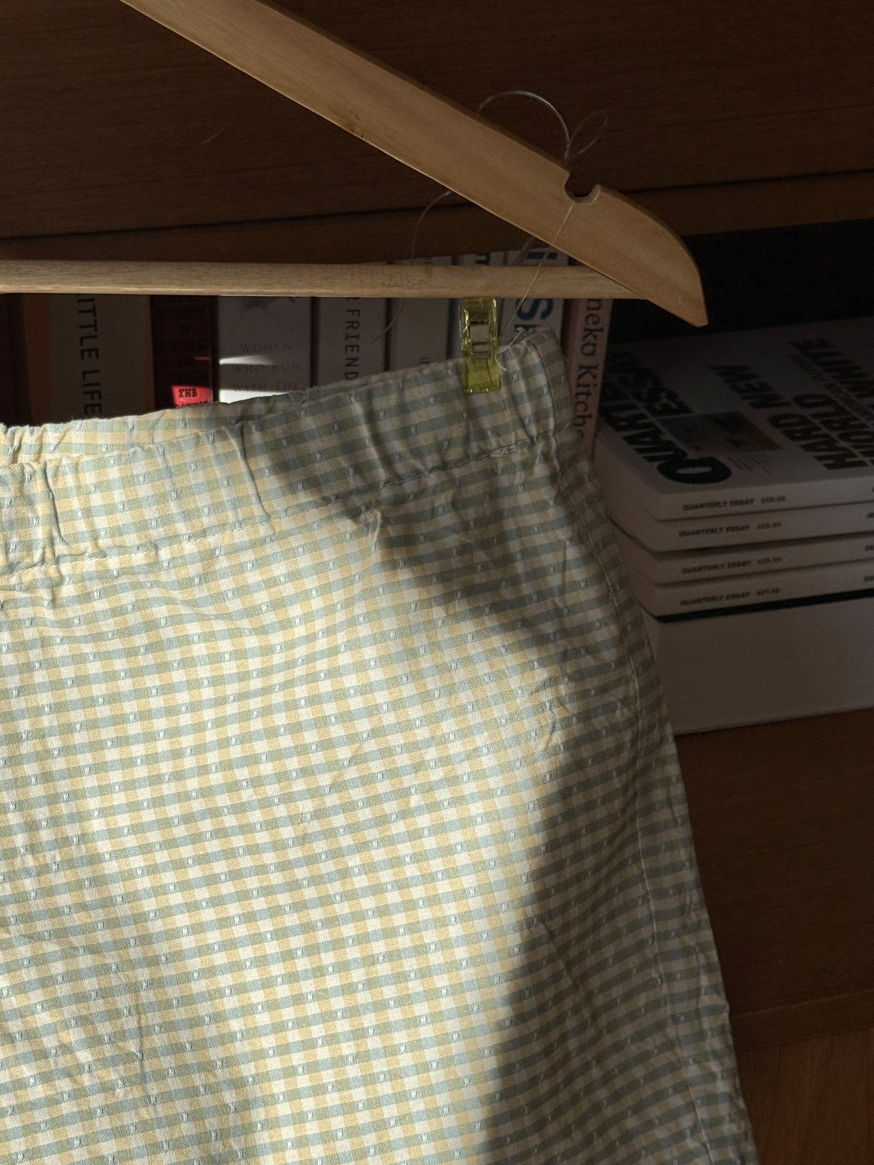 closeup of yellow and green checkered shorts