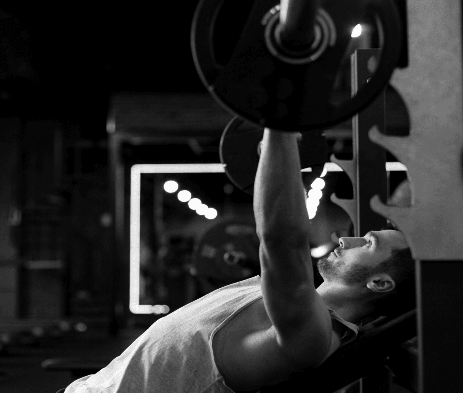 Man performing strength sculpture workout