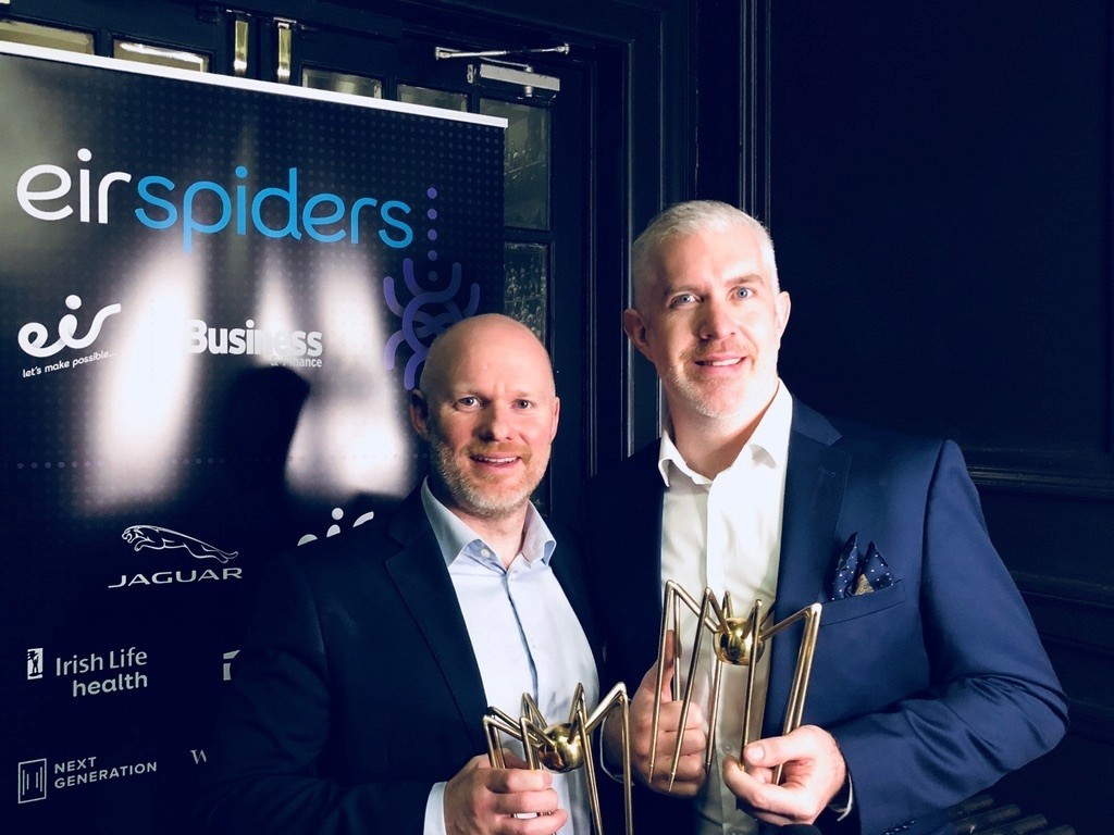 Photo of MyWallSt Co-founders, Emmet Savage and John Tyrrell, collecting their Grand Prix award at the Eir Spider Awards