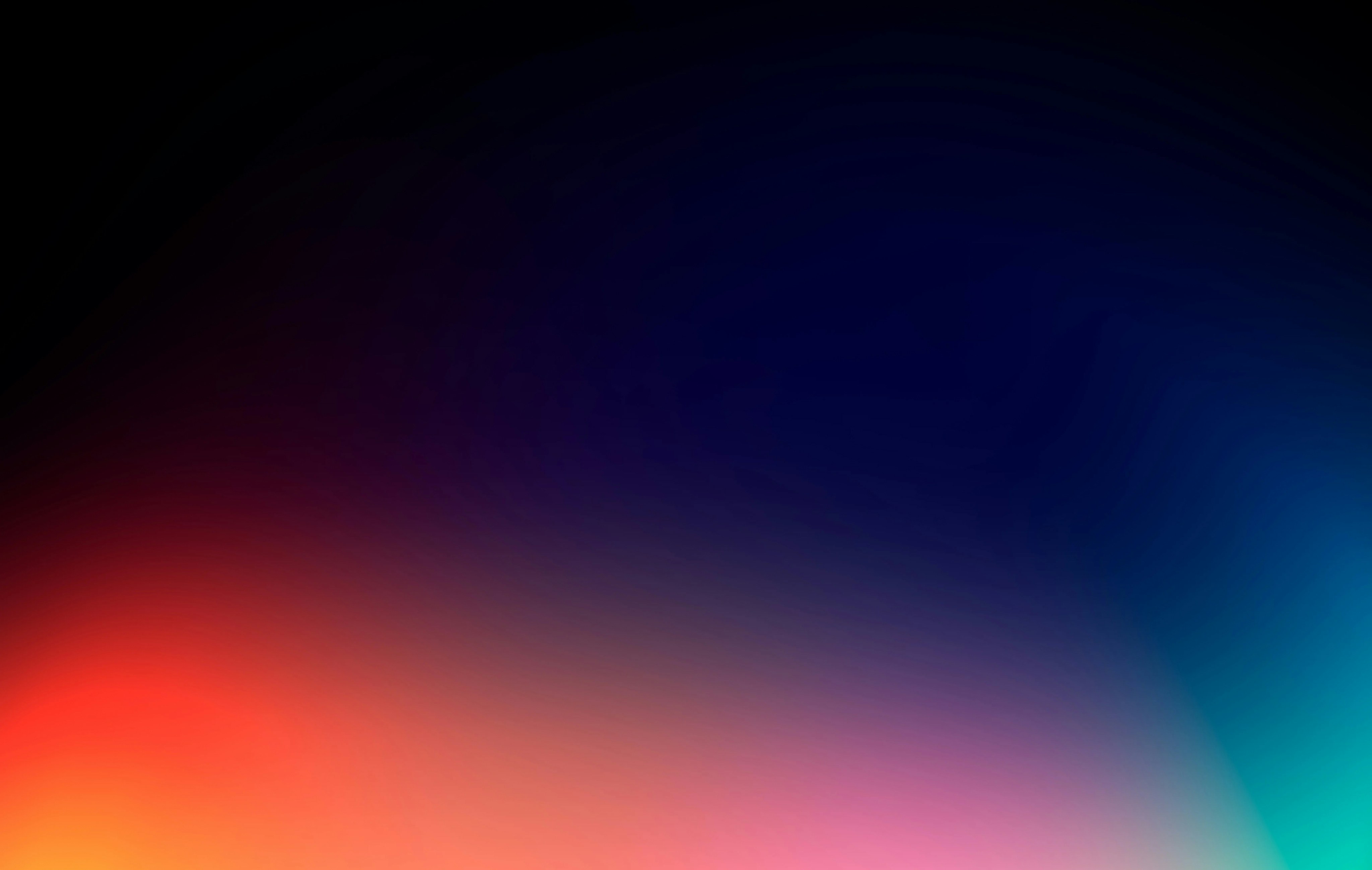 A colorful gradient blends from red to blue.