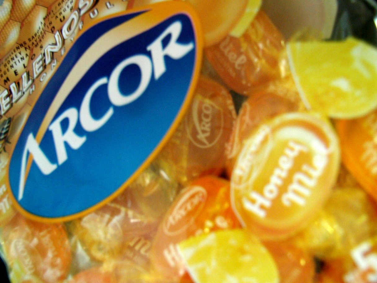 Rooftops of a coastal town with the sea in background