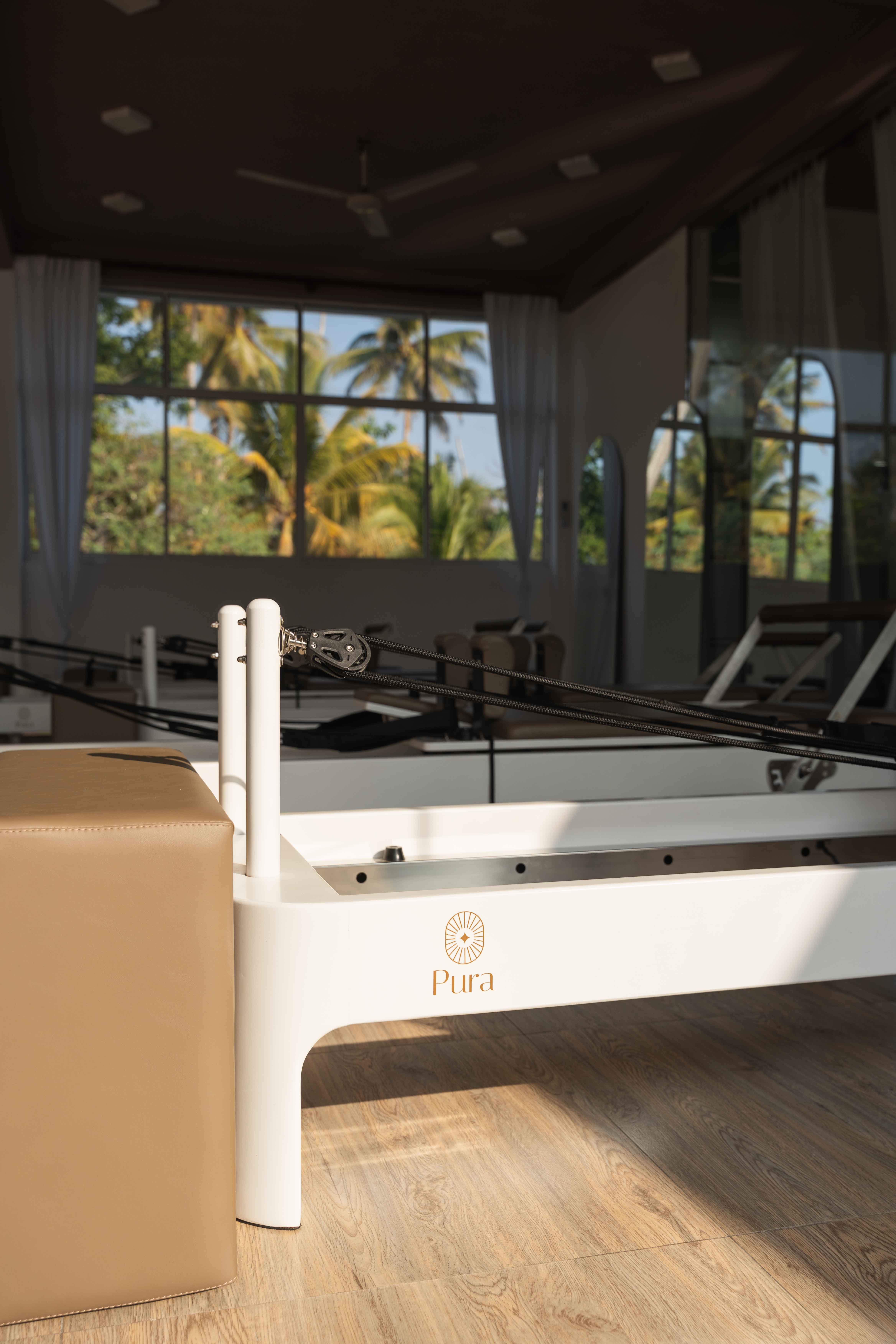 Reformer Pilates Studio in beige and green tones