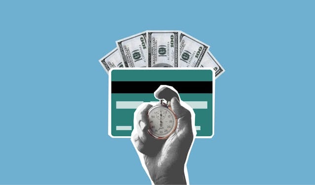 Hand holding a stopwatch with a credit card and dollar bills in the background
