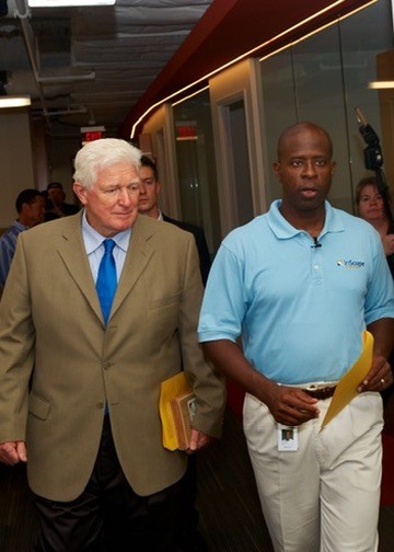 Mike Bruce standing with a colleague at an industrial site
