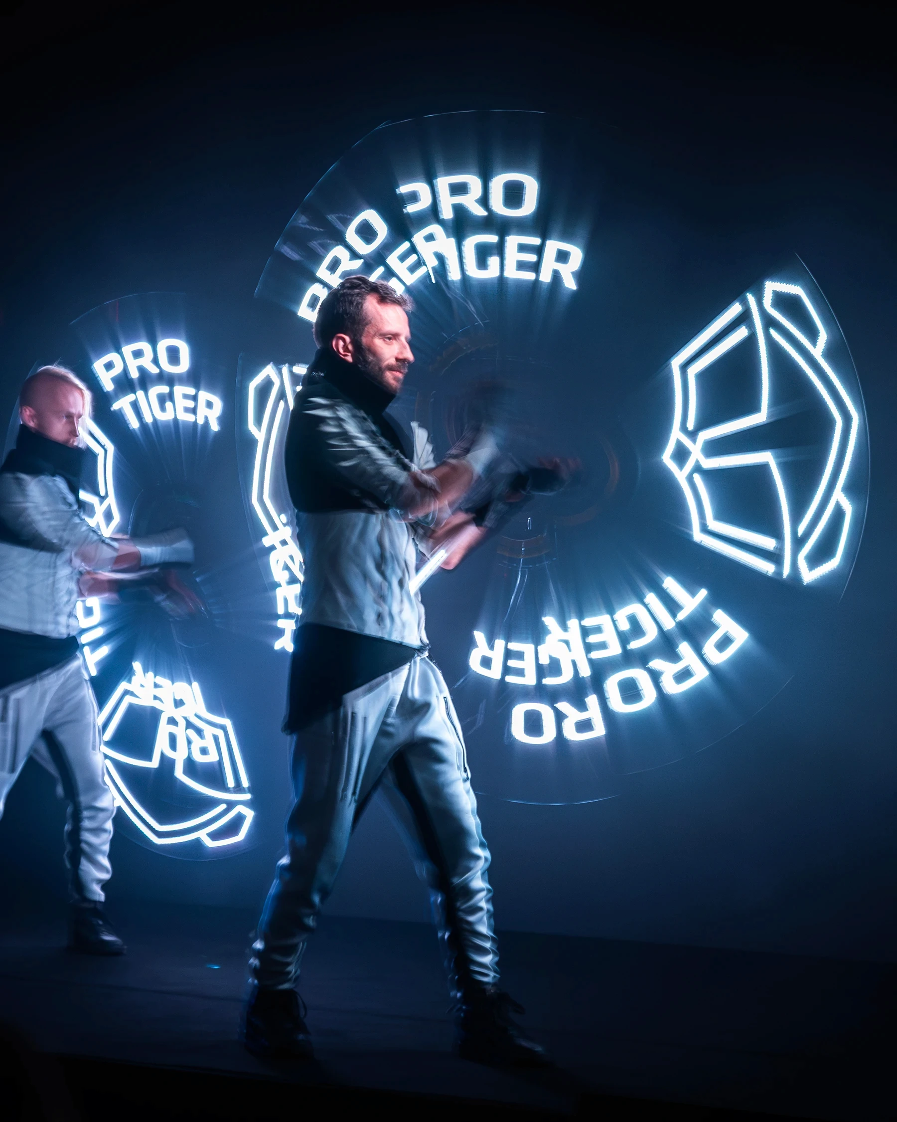 Artists on stage; artists with lasers in logo shape