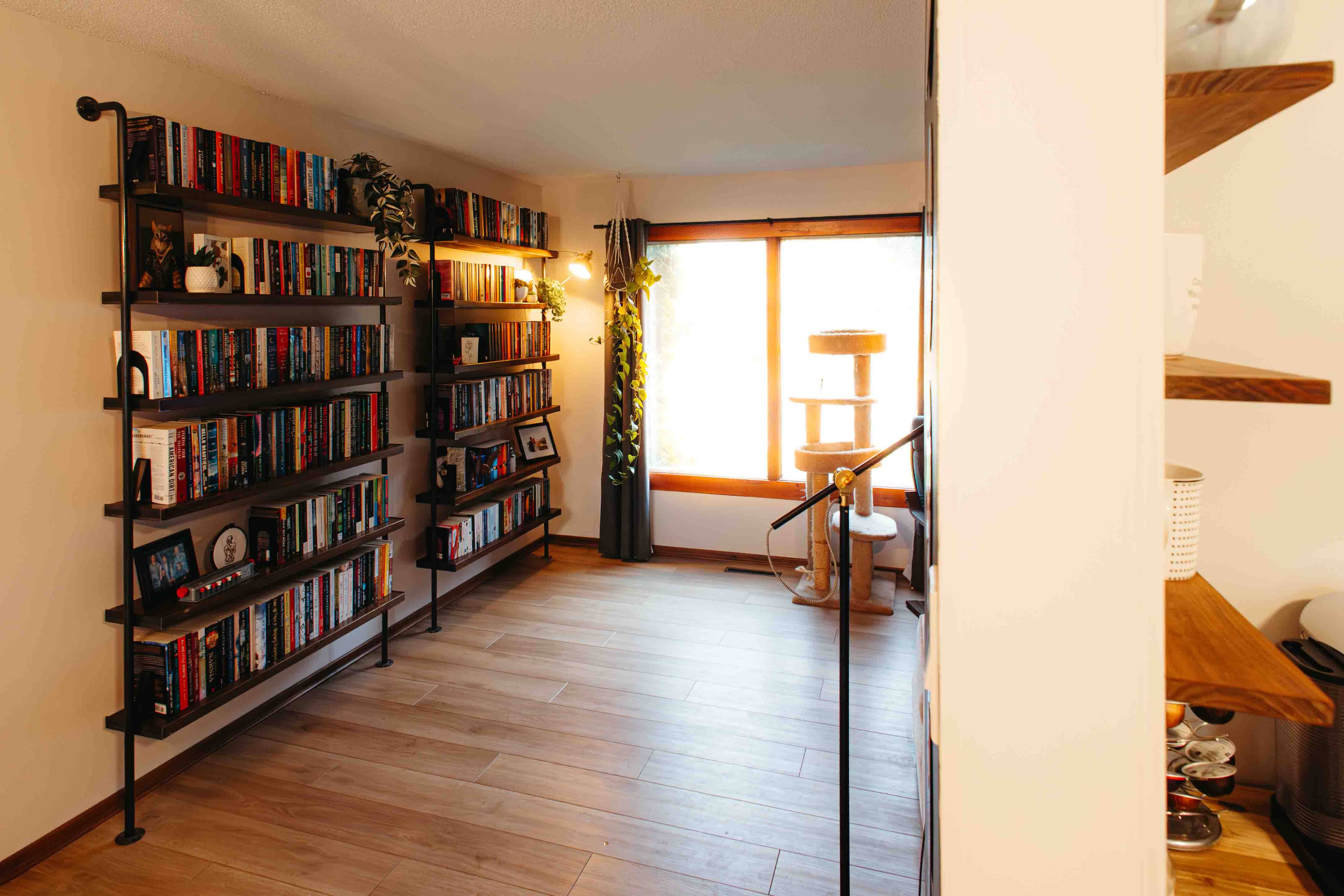 A Saskatoon living room after renovation featuring custom bookshelves