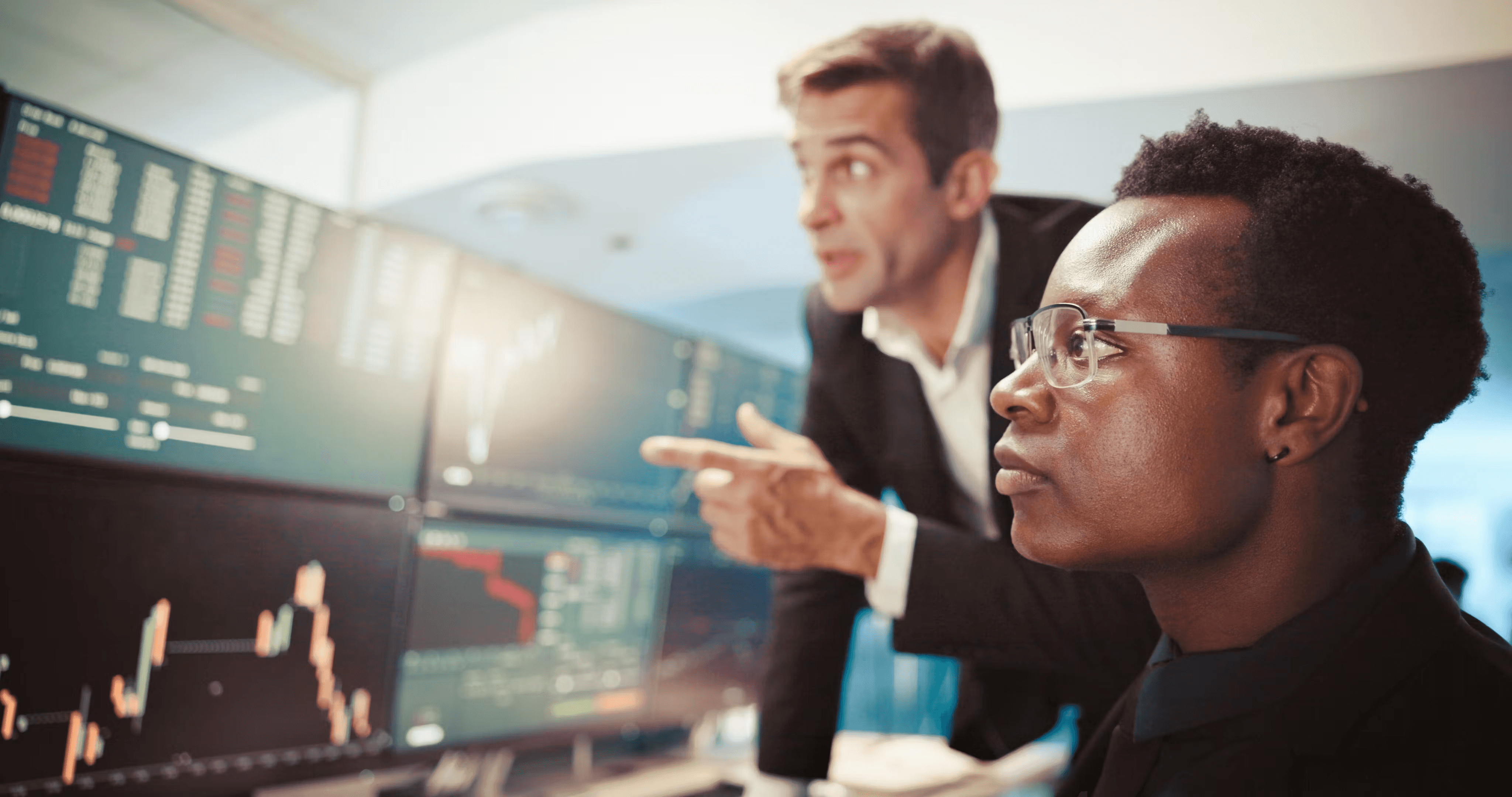  Two stock traders analyzing market charts - What is Onchain