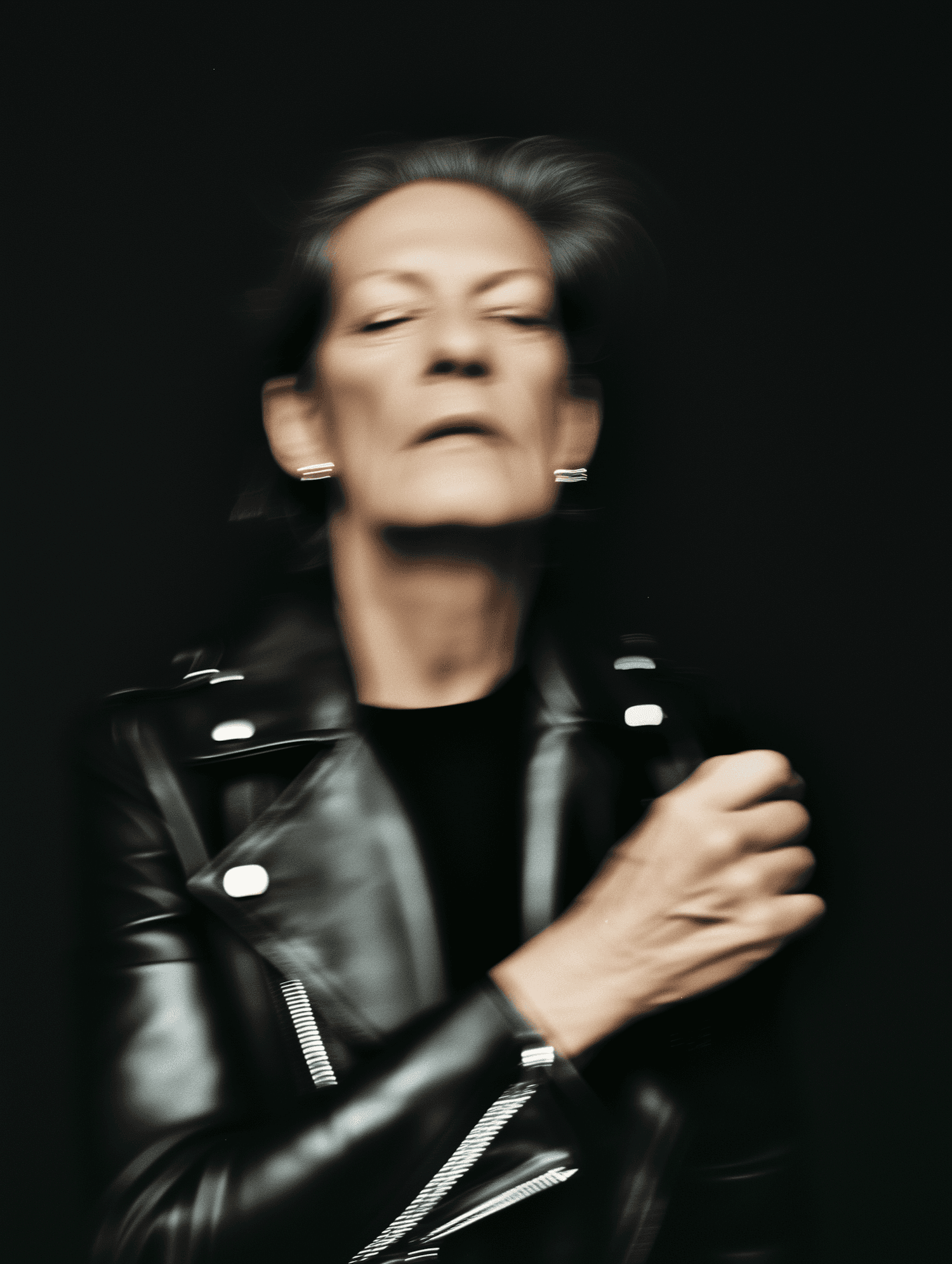Woman in leather jacket with soft motion blur