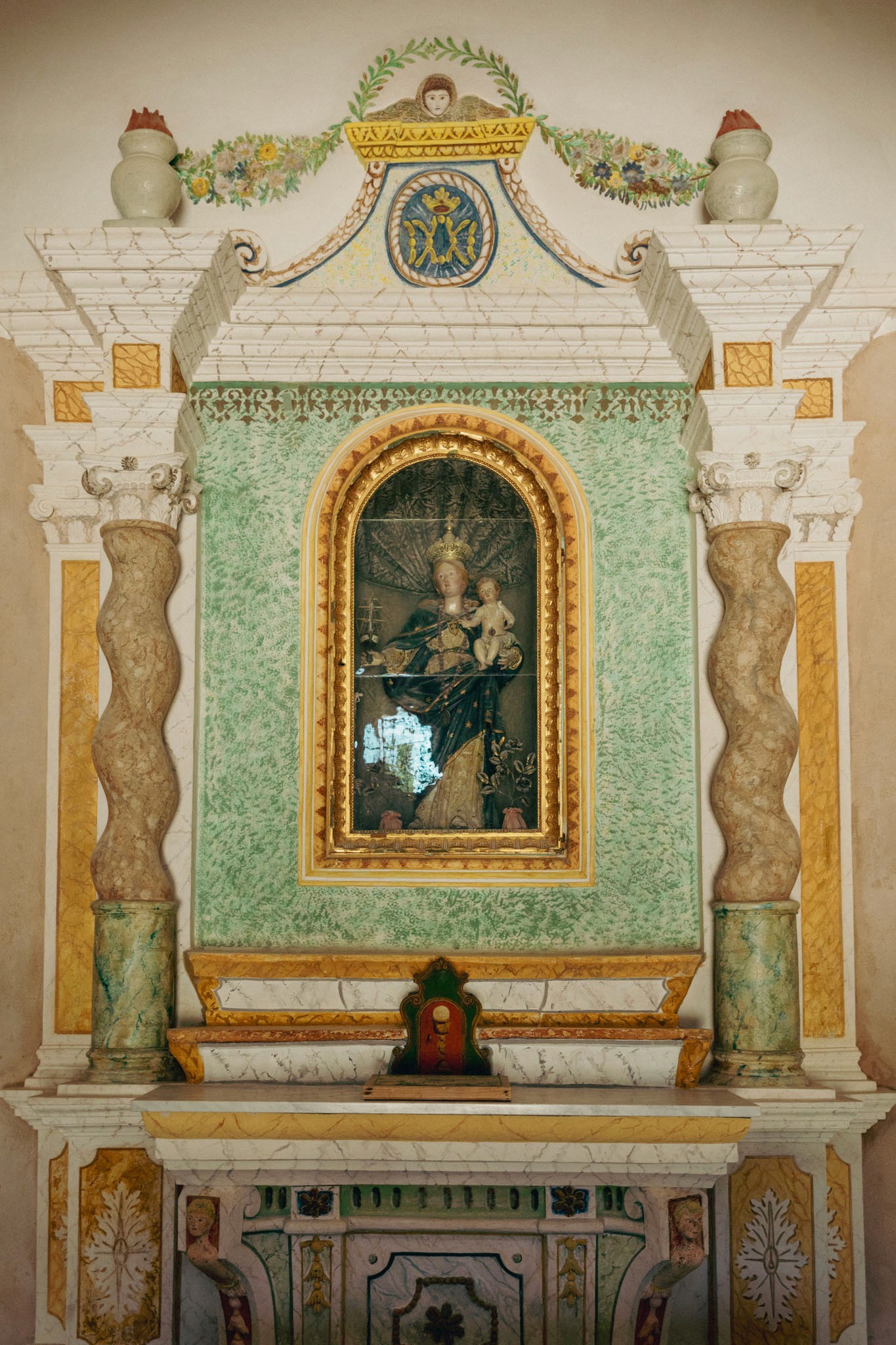 A couple stands closely in an intimate embrace.