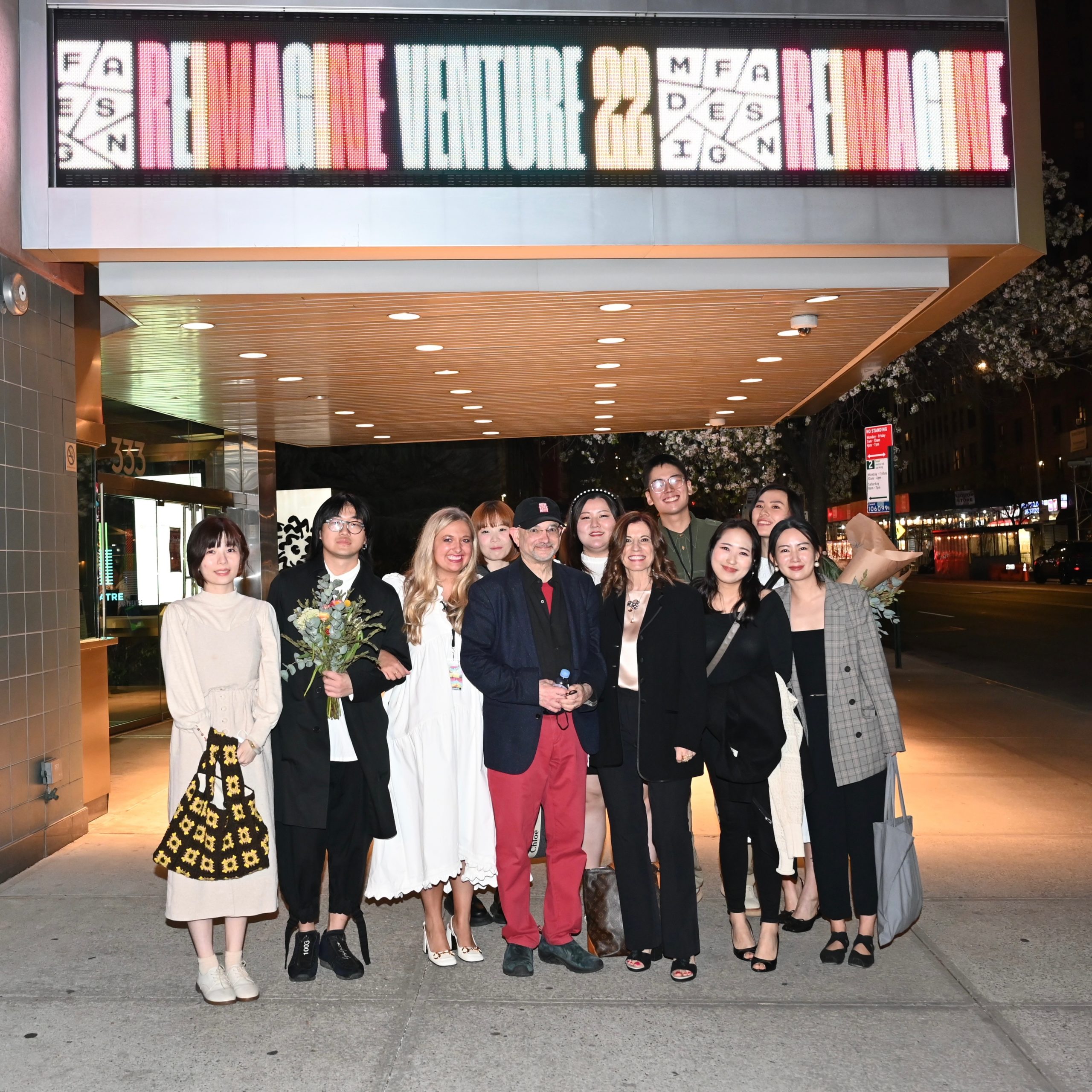Venture 22 students outside theater