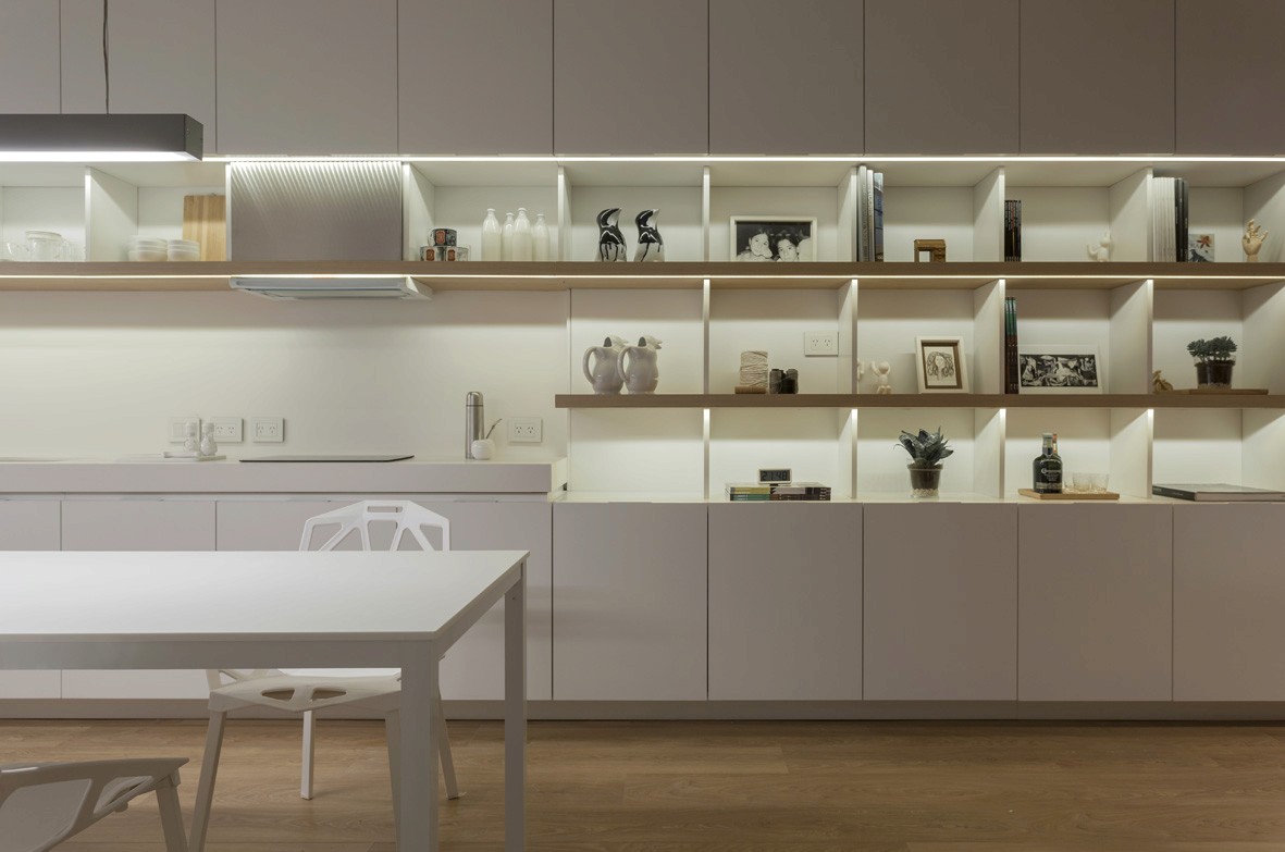 Free Framer Template - Two young men converse in a cozy, rustic setting with wooden decor, one on a laptop and the other gesturing.