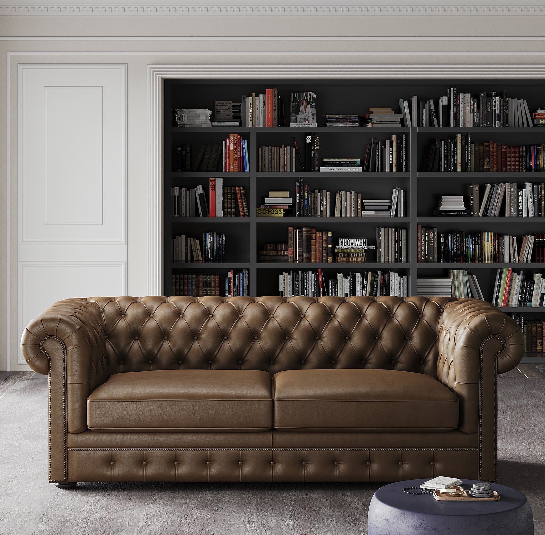 Leather chesterfield sofa in classic living room with bookshelf backdrop