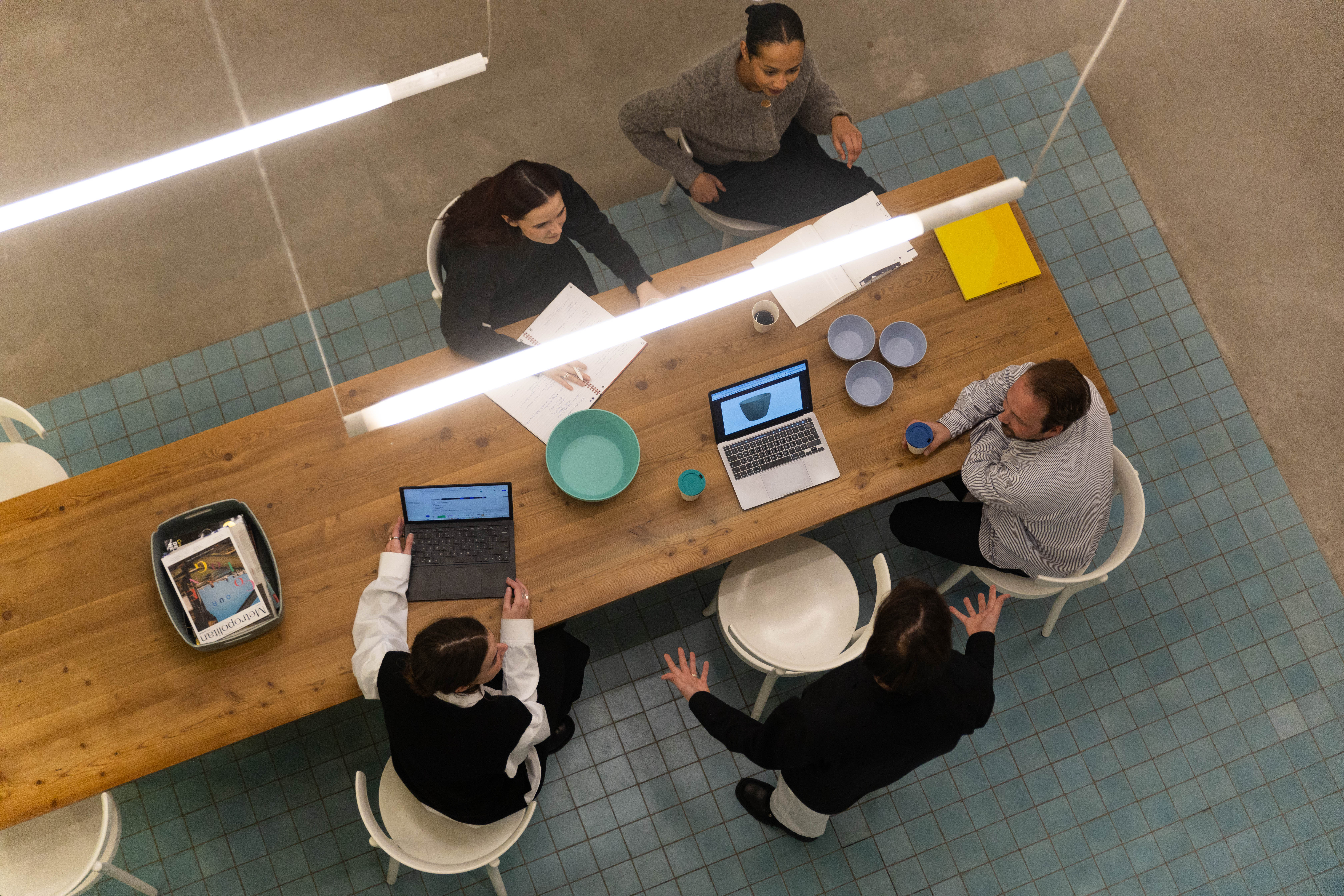 UBITE People working at an office table