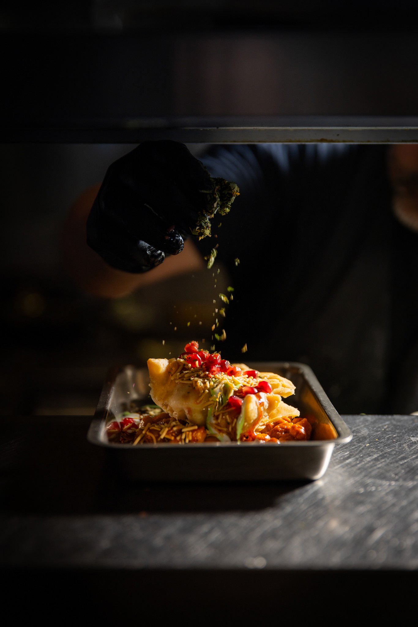 Chef cutting red bell peppers