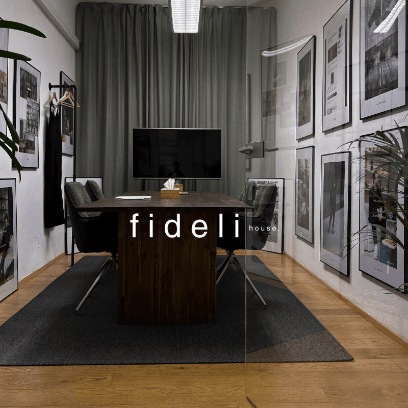 Free Framer Template - A modern building with a sleek, curved glass facade against a blue sky.