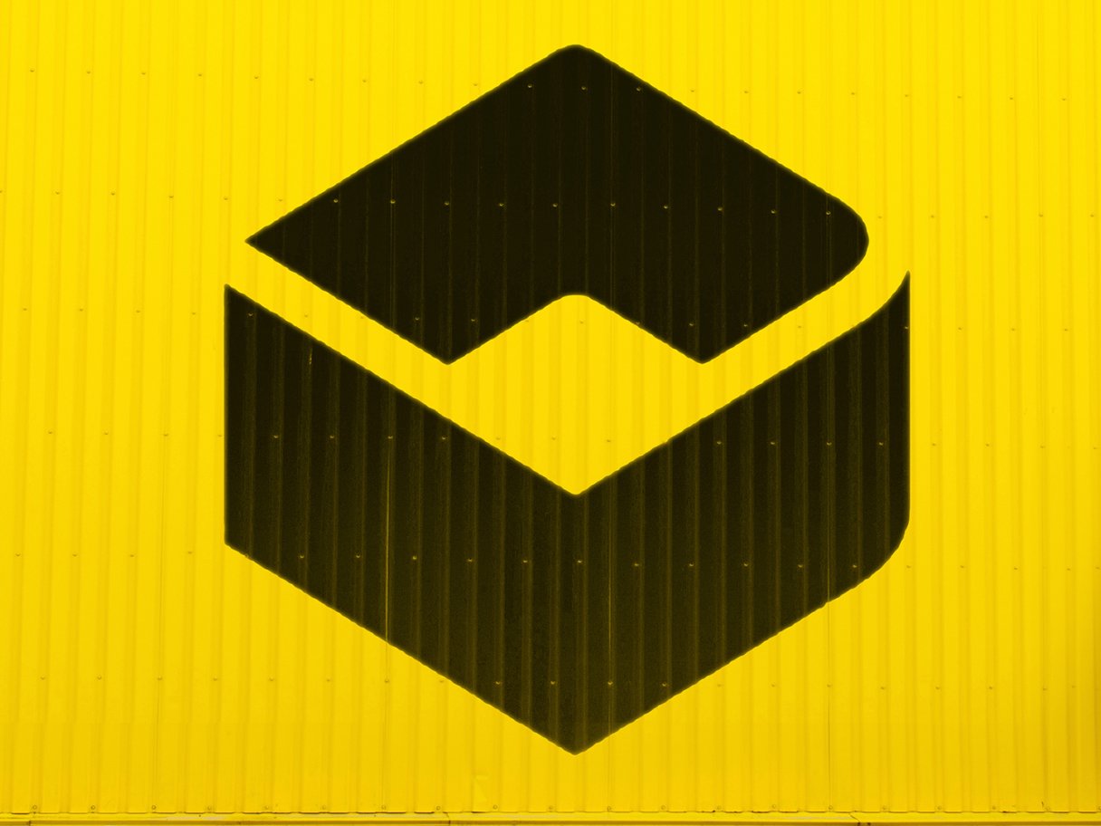 Rooftops of a coastal town with the sea in background