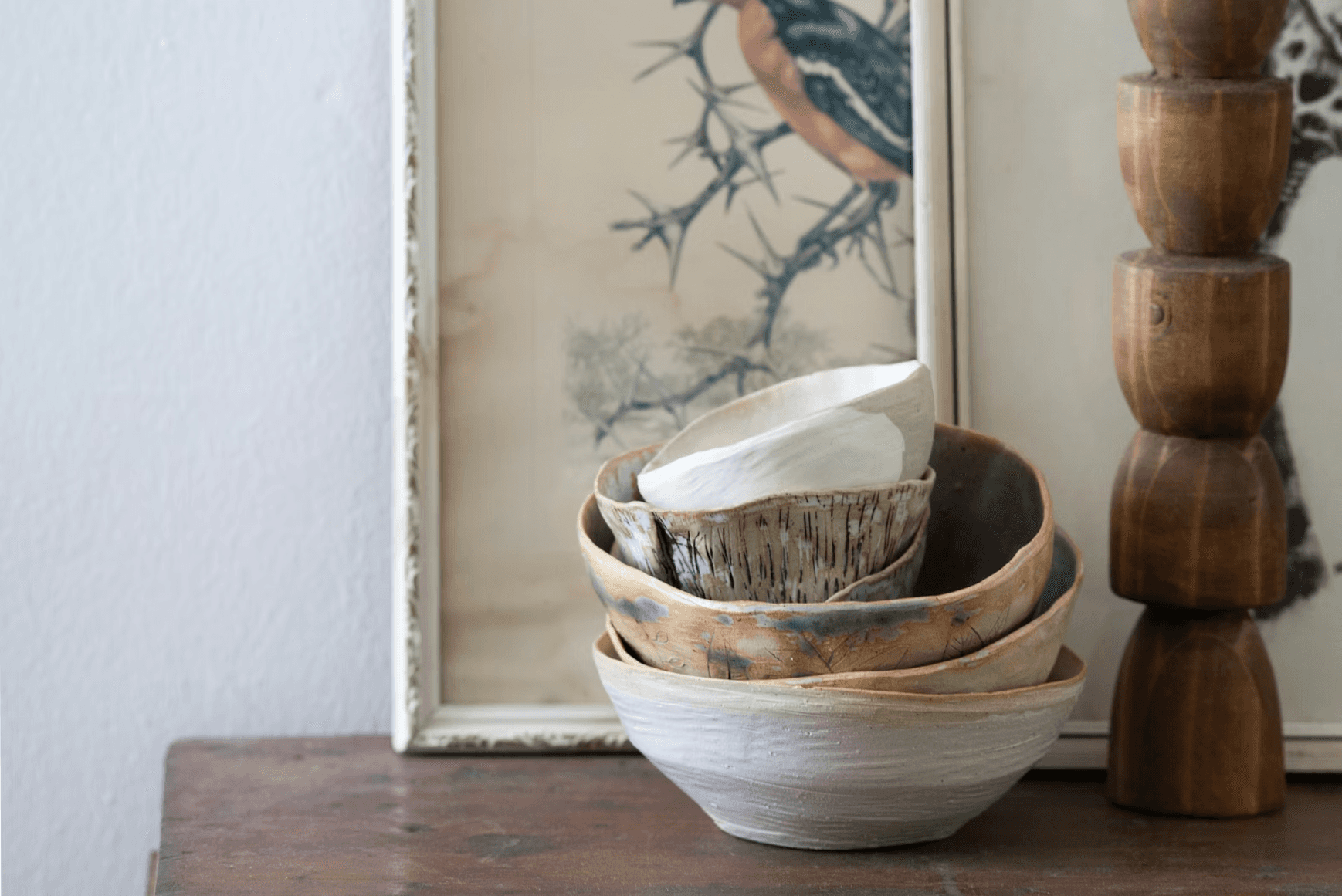 A picture of a bird and a bowl on a table