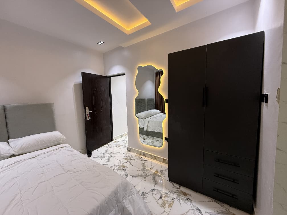 Comfortable bedroom at Cedar The Crest, one-bedroom serviced apartment in Yaba, Lagos
