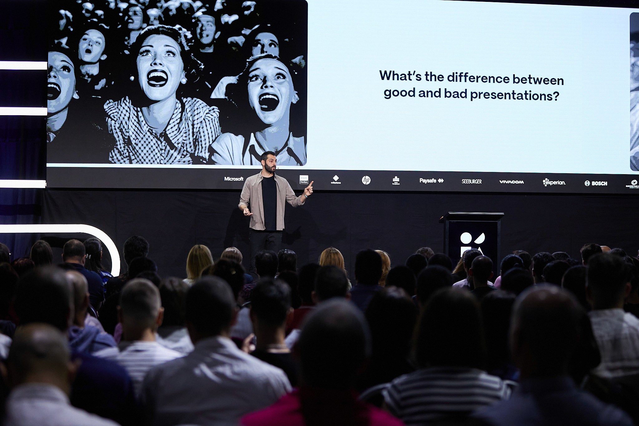 damon nofar giving keynote presentation on stage