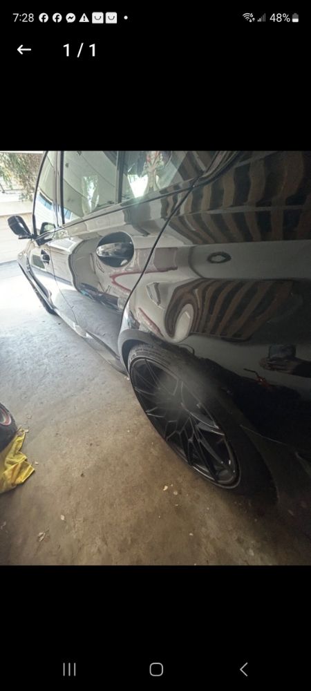 BMW M4 Competition quarter panel dent