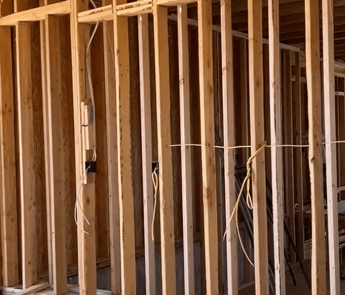 Interior framing and electrical rough-in during construction of a custom home in Ivins, Utah.