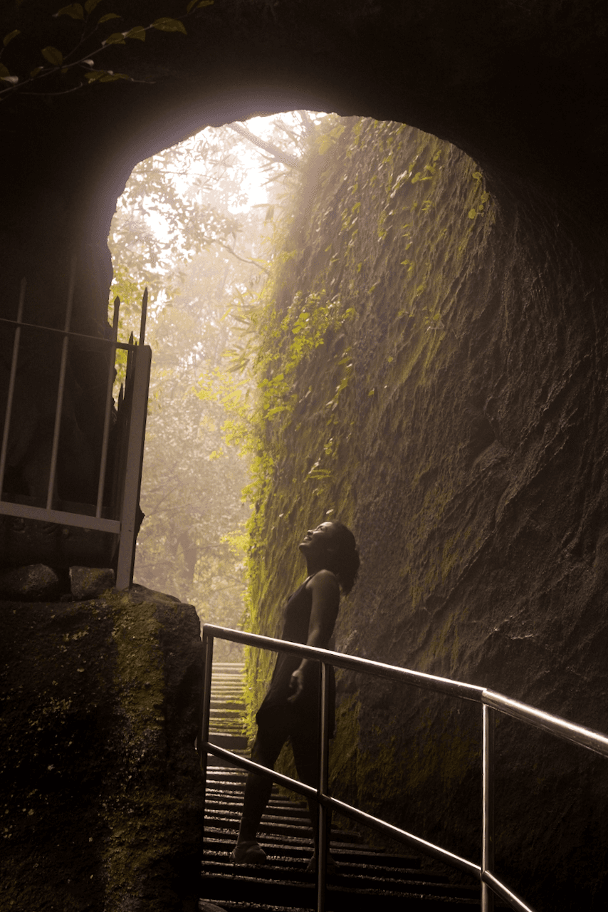 Hiker posing with the sunlight streaming in the background
