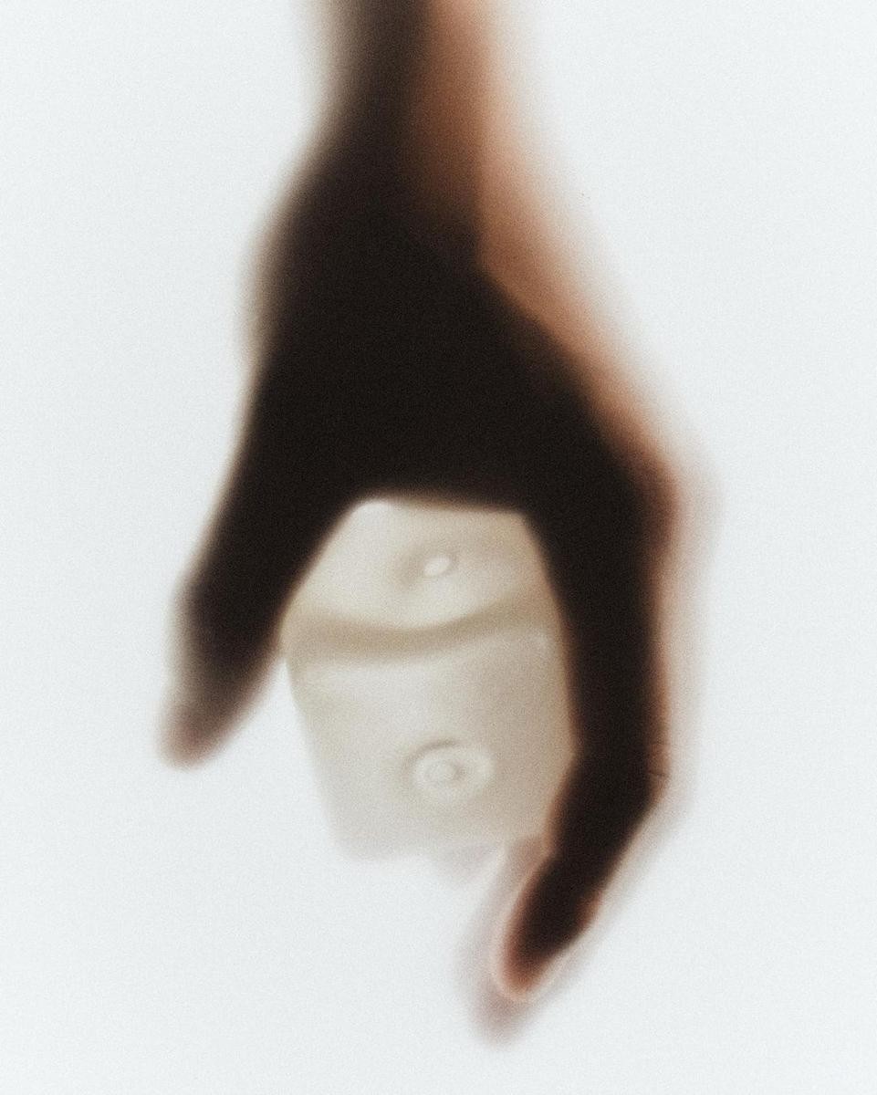 Woman Crossing Zebra Crossing Against Yellow Wall