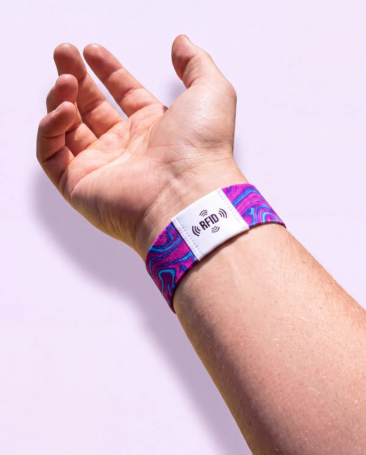 Stretch fabric wristband with custom label and seamless closure