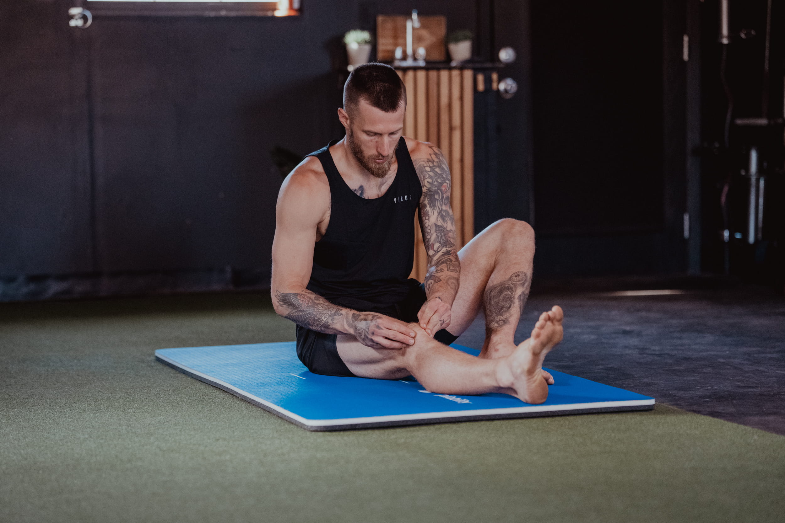 person checking his thighs - Stiffness in Thighs and Legs
