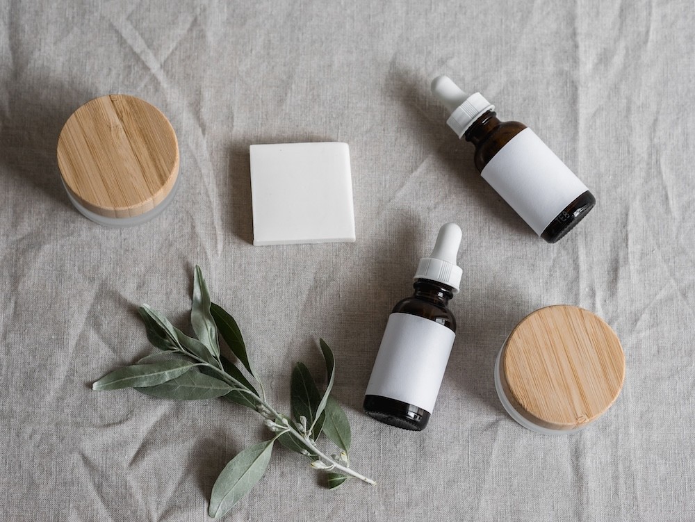 Jars, droppers and soap on a tablecloth