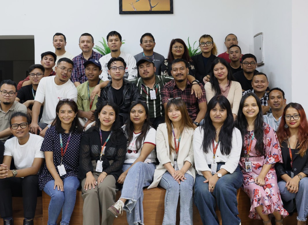 Large group of diverse people smiling and posing for a photo. Team photo, employees, coworkers, smiling people.