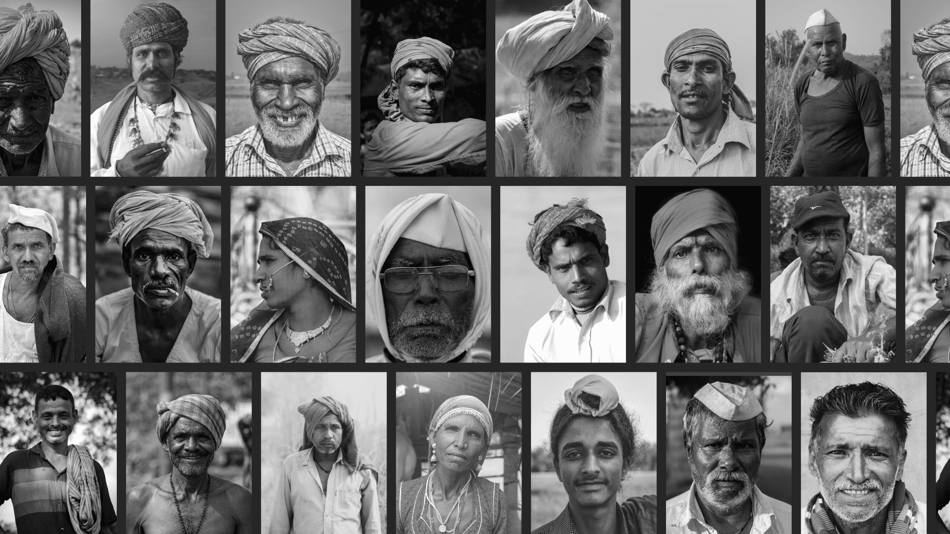 a man with a stick walks along a river bank