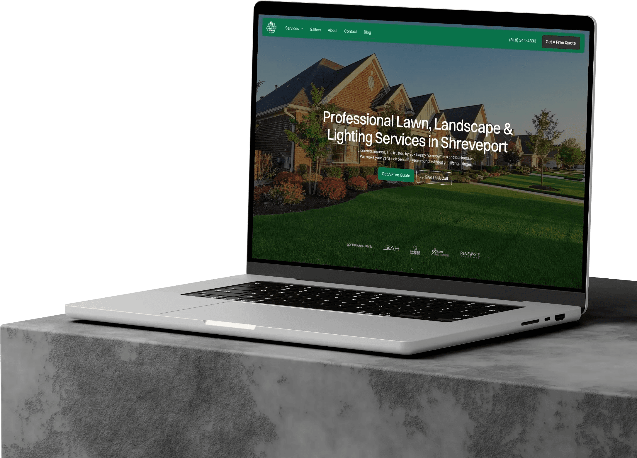Barefoot Lawns & Lights Website designed by DesignPing displayed on a Laptop siting on a concrete slab.