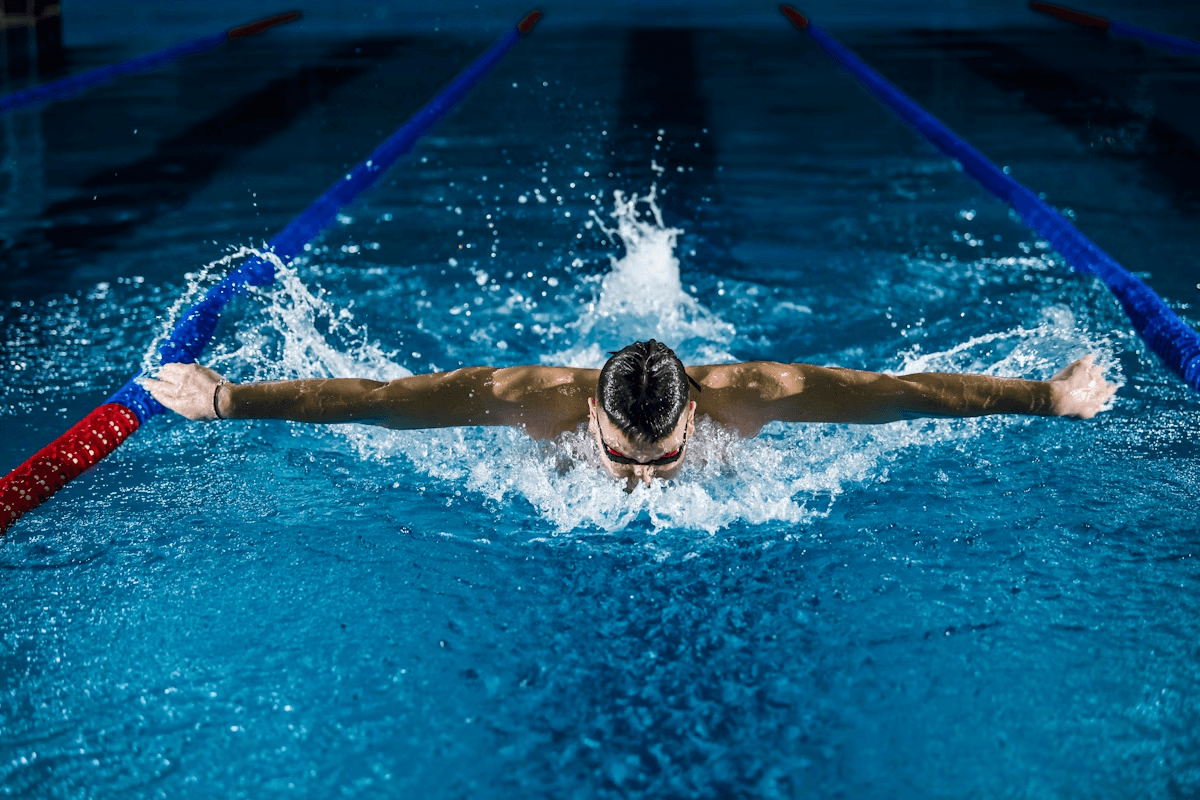person swimming butterfly
