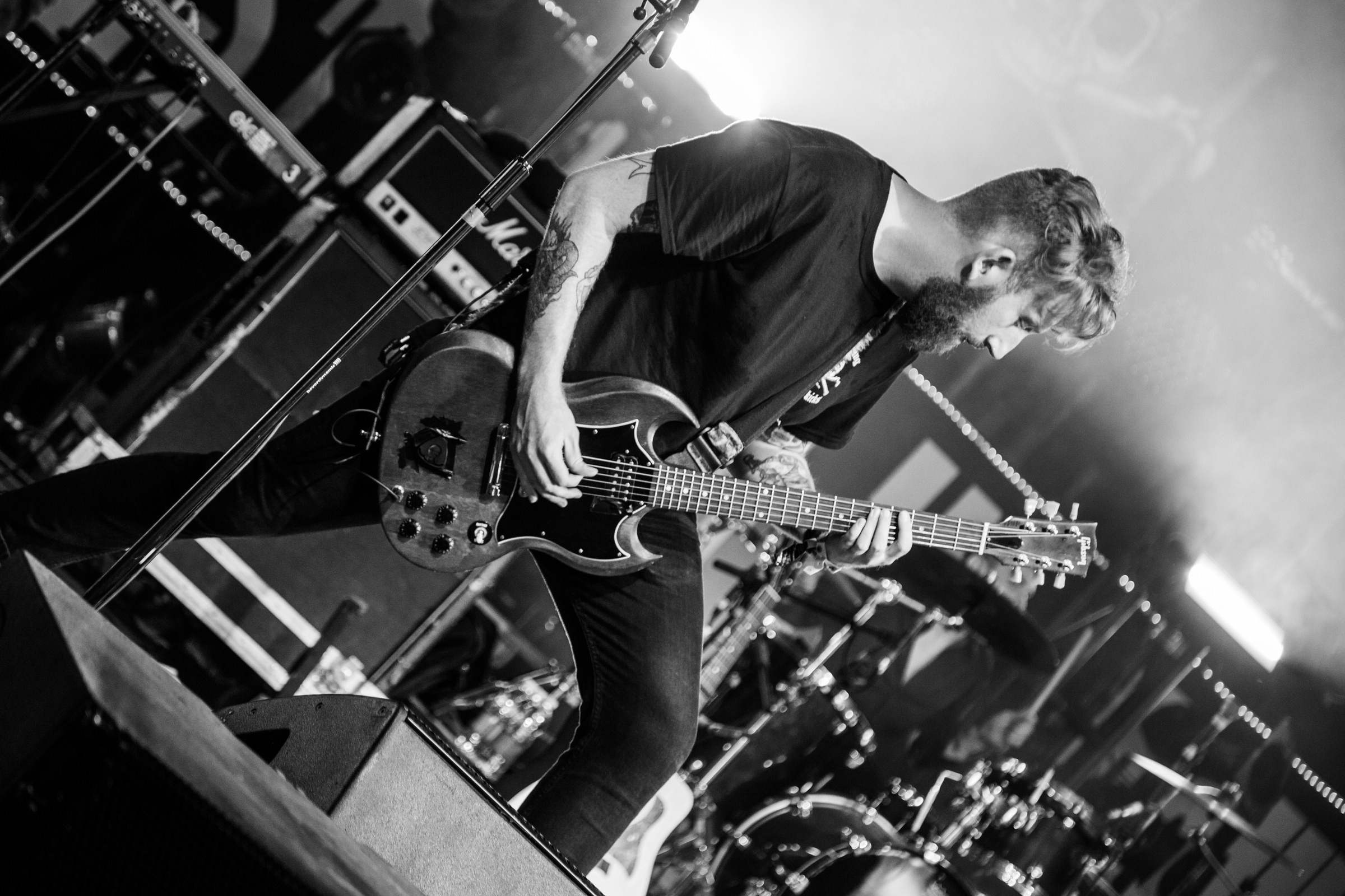 EVENTS · A guitarist in action, in black and white.