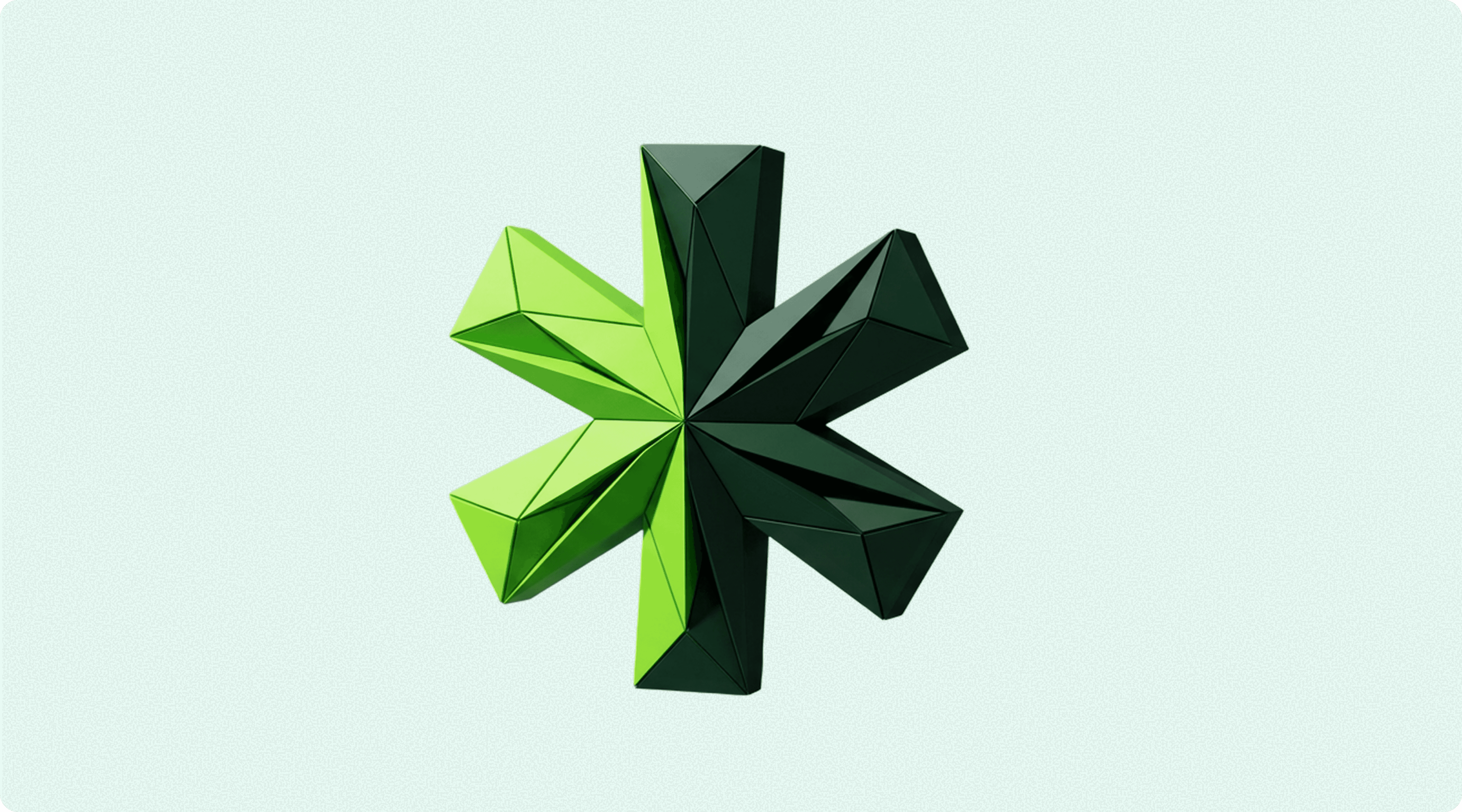 A 3D abstract star shape with green and dark green facets.