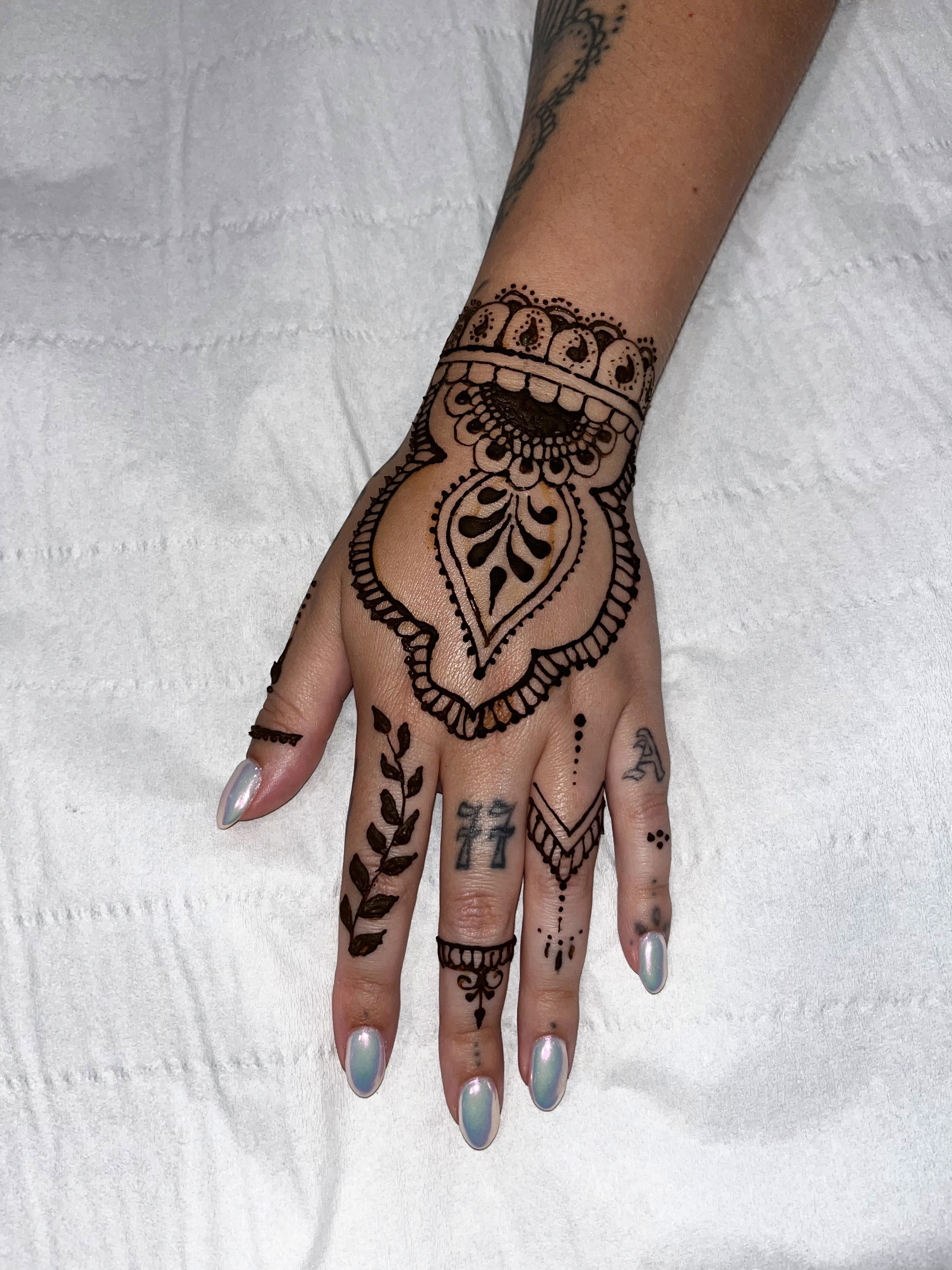 Mandela design henna on hand and wrist