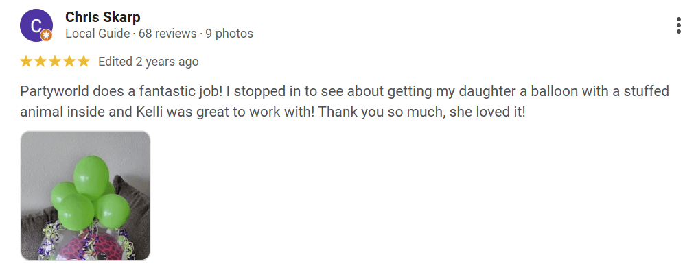 A review with five yellow stars highlights customer satisfaction with Partyworld, featuring an image of a whimsical green balloon arrangement adorned with colorful stuffed animals, praised for excellent service in providing a unique gift.