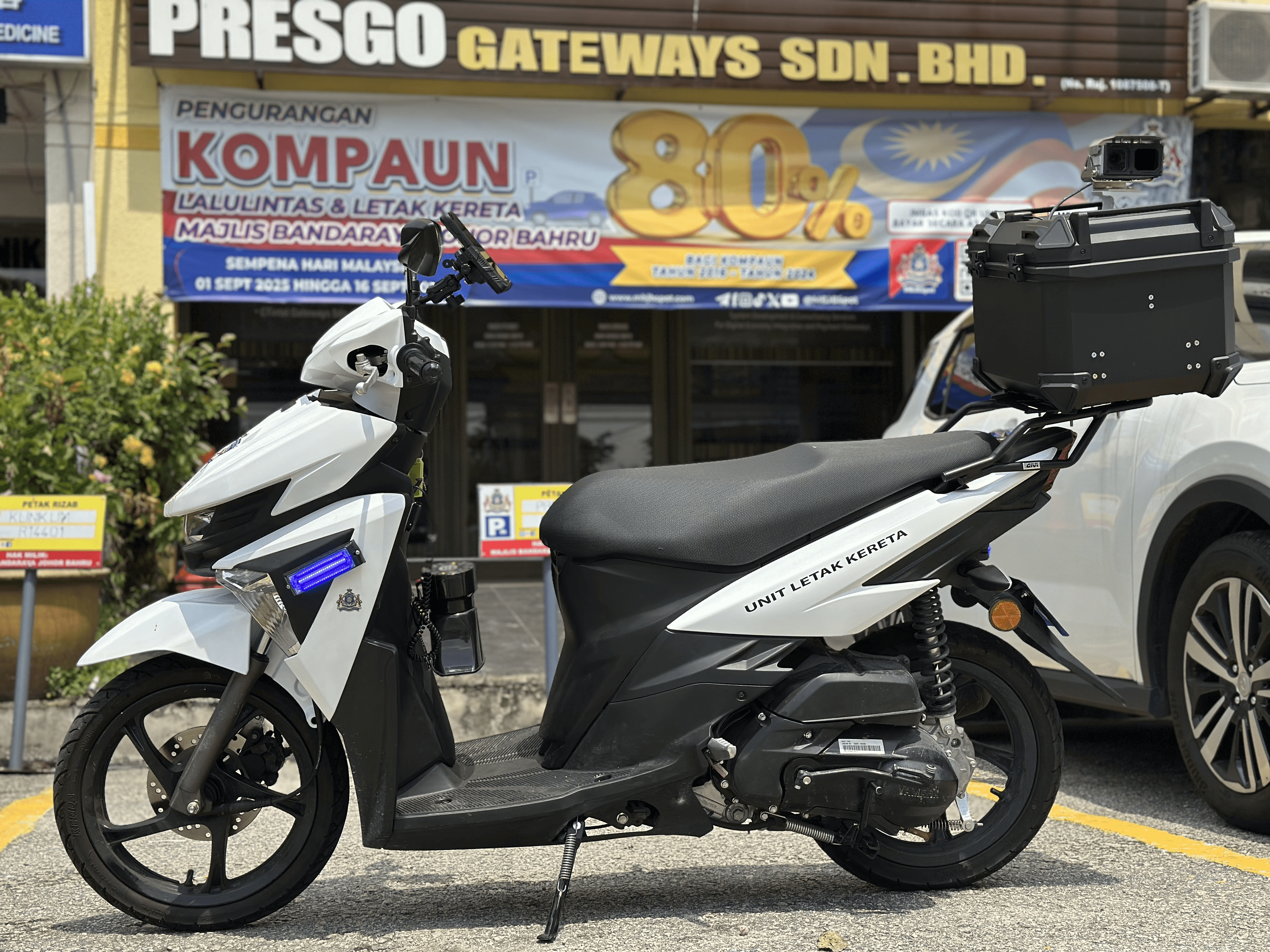 Two colleagues collaborating on a laptop in office.