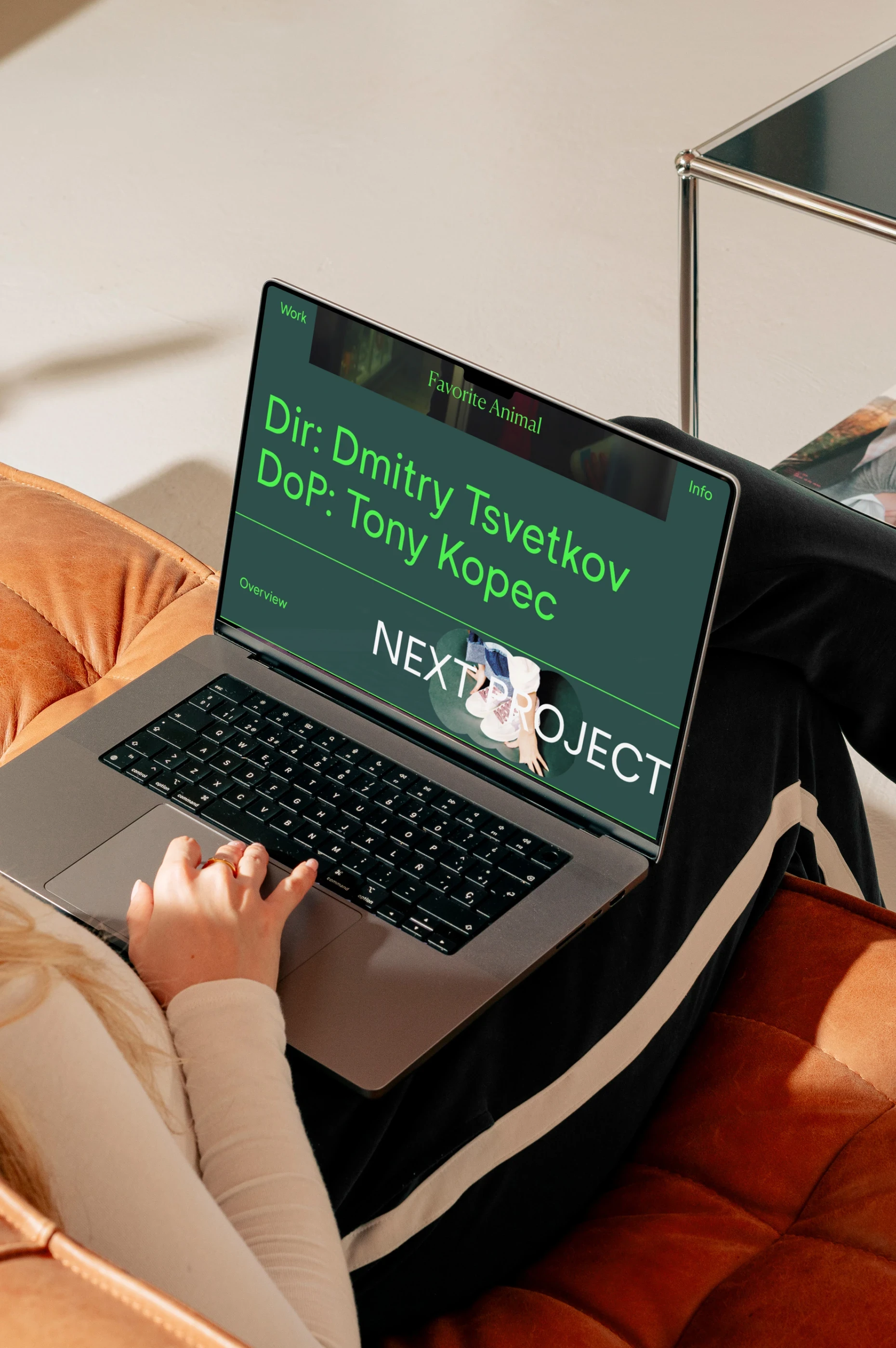 Website design made for Favorite Animal production company, shown on a computer on a woman's lap.