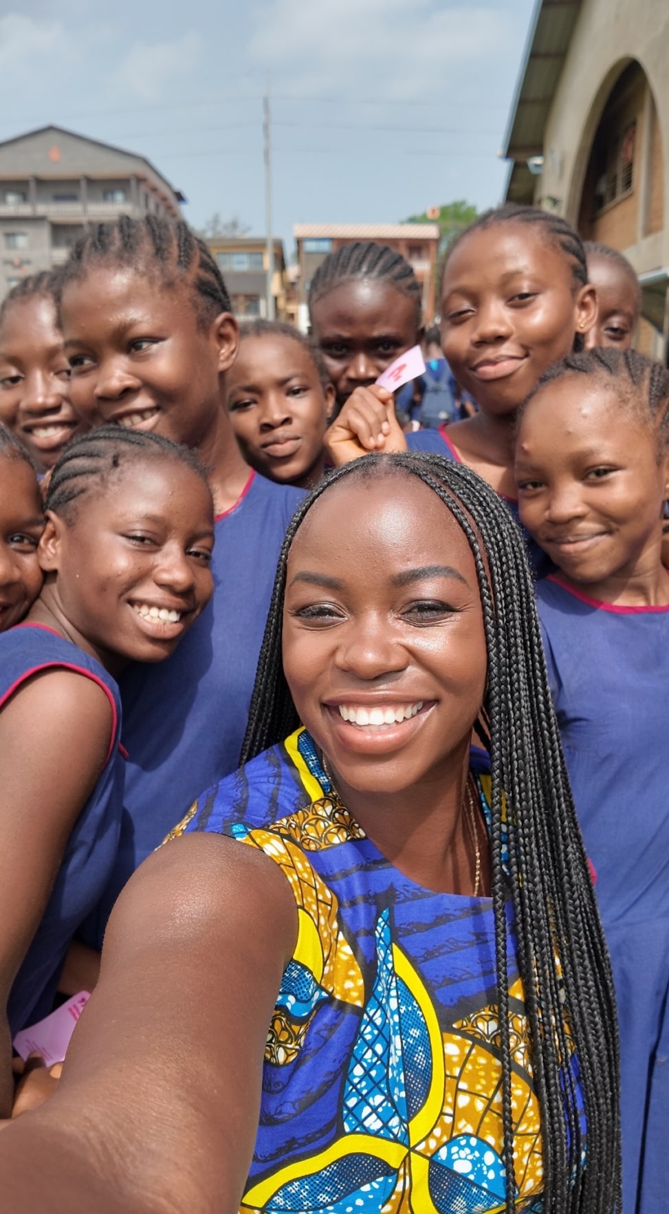 The founder taking a selfie with a group of students.