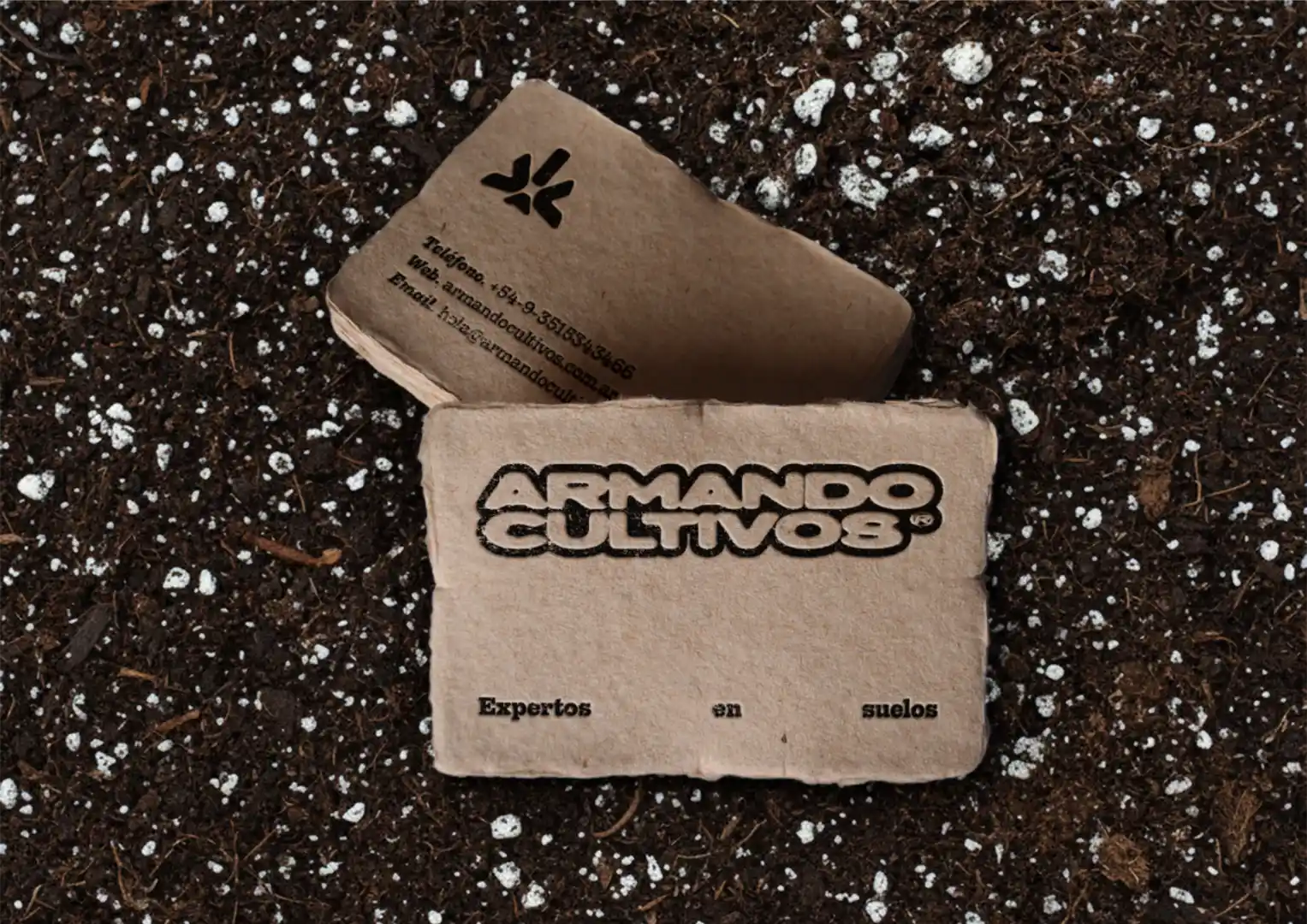 Armando Cultivos business card mockup on soil