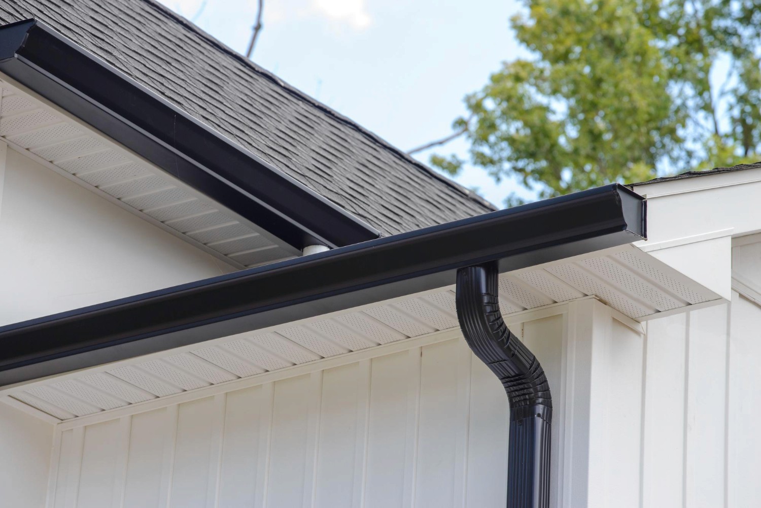 Rain gutter of roof with downpipe