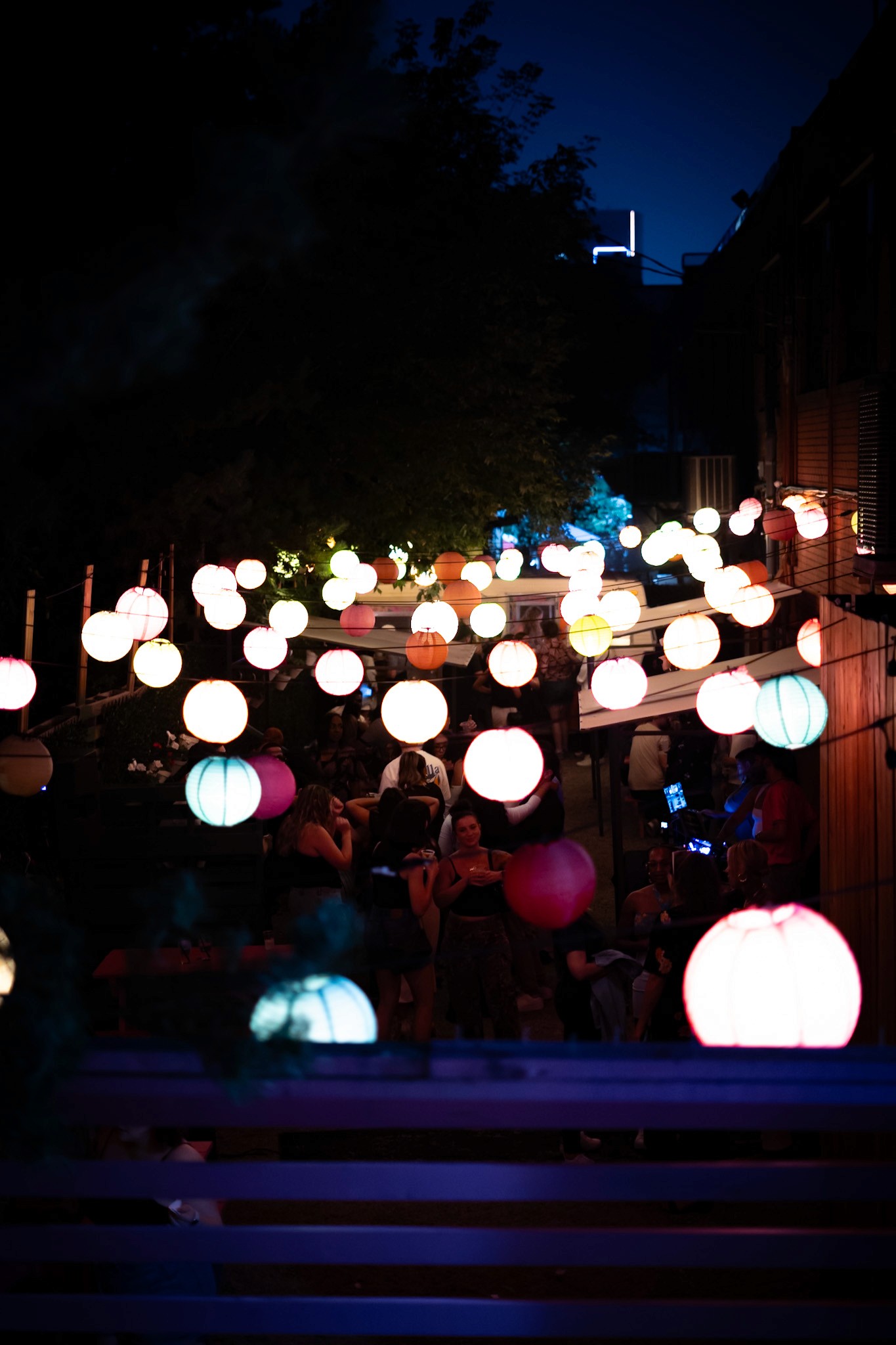outdoor patio round lights on string people dancing