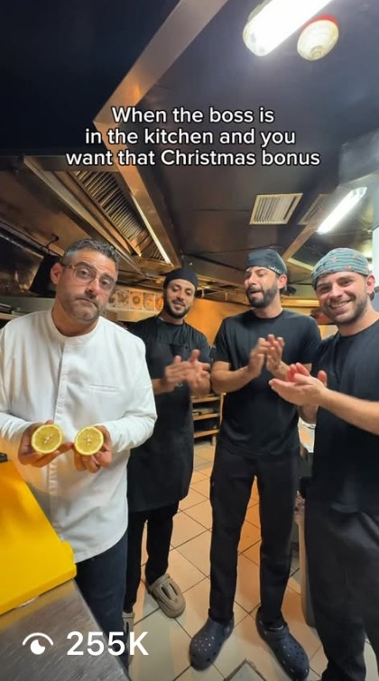 outtake from viral Instagram reel. chef standing in the kitchen with staf