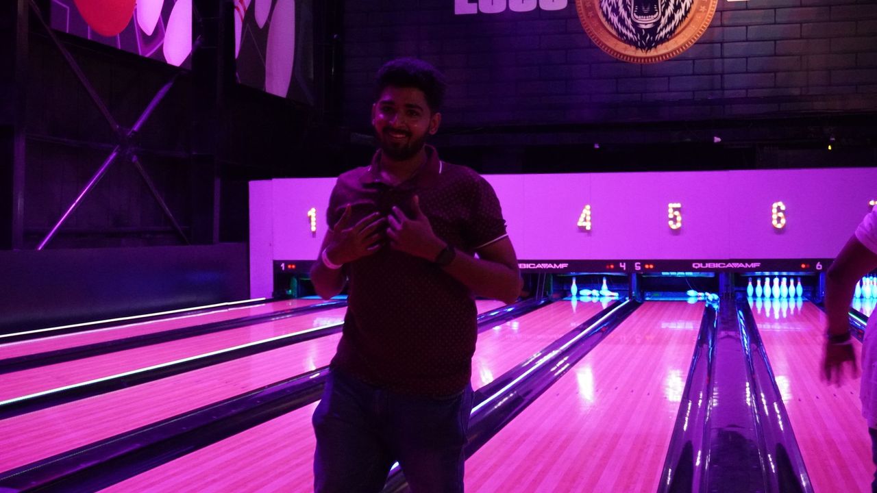 Group of men standing with Sufboard
